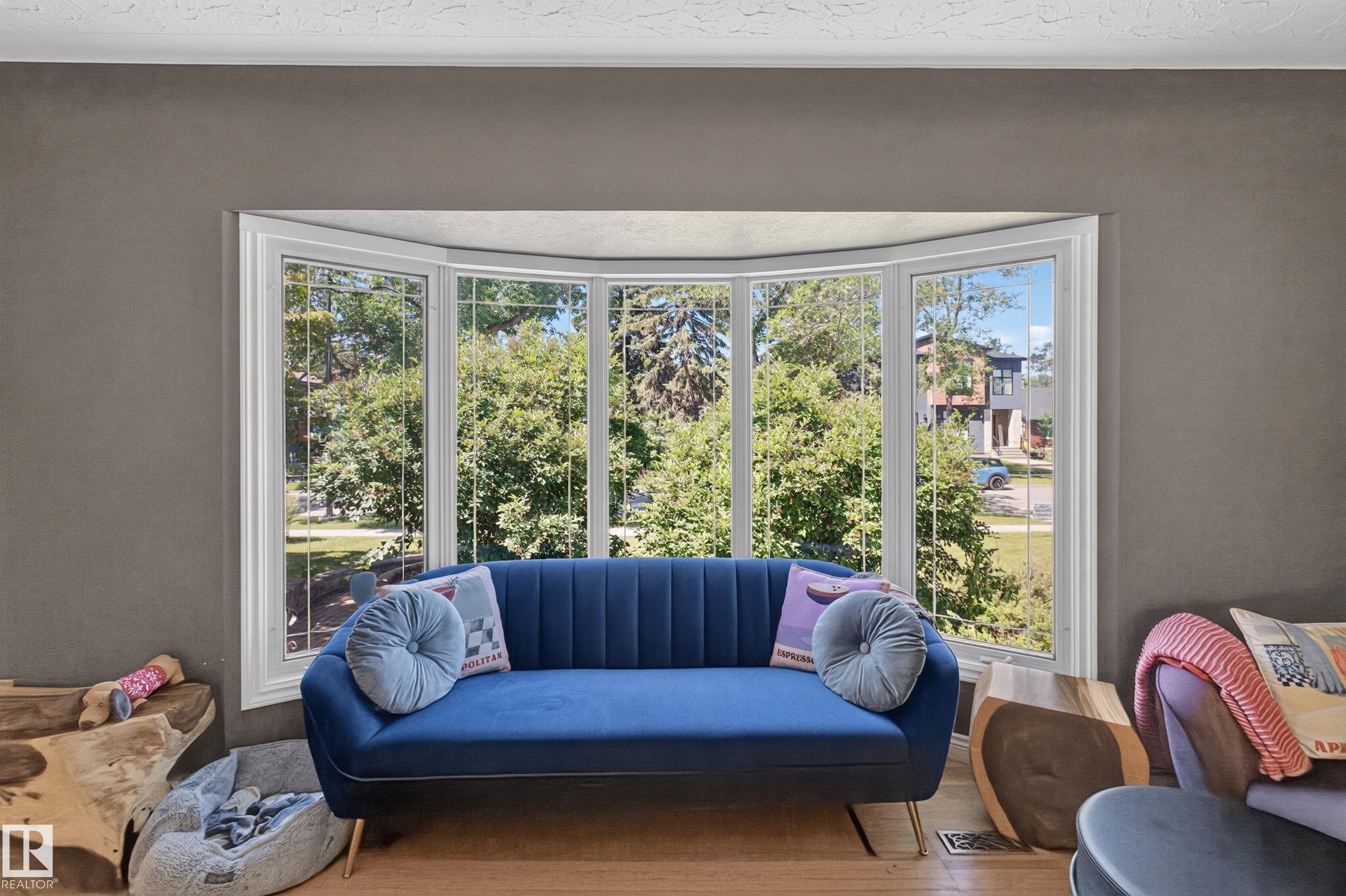 Expansive bay window featuring white trim and multiple panes of glass - 11015 122 Street, Edmonton, AB