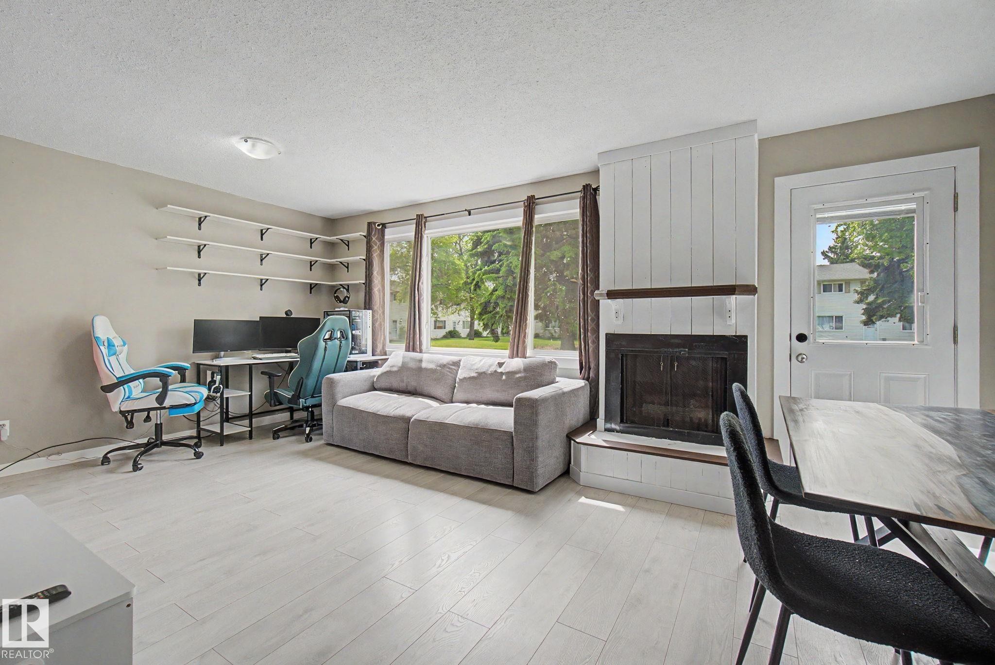 4315 46 Street, Stony Plain, AB - Indoor Photo Showing Living Room With Fireplace