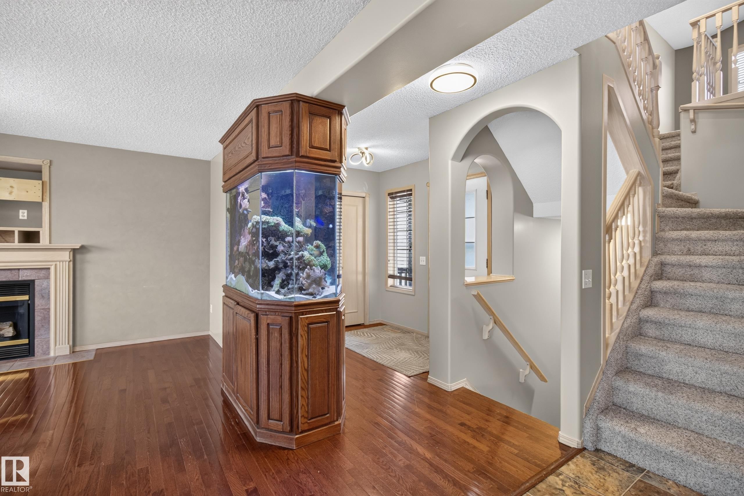 Integrated aquarium with custom wood cabinetry - 13406 32A Street, Edmonton, AB