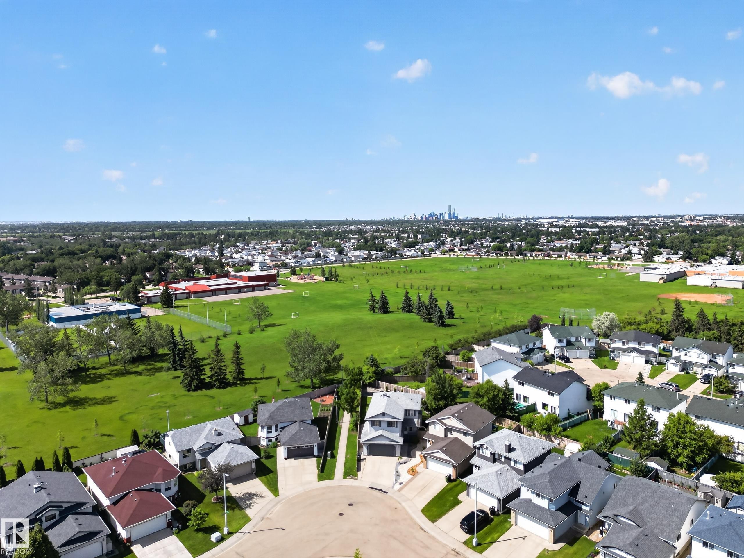 Aerial perspective showcasing a residential area with varied housing styles - 13406 32A Street, Edmonton, AB