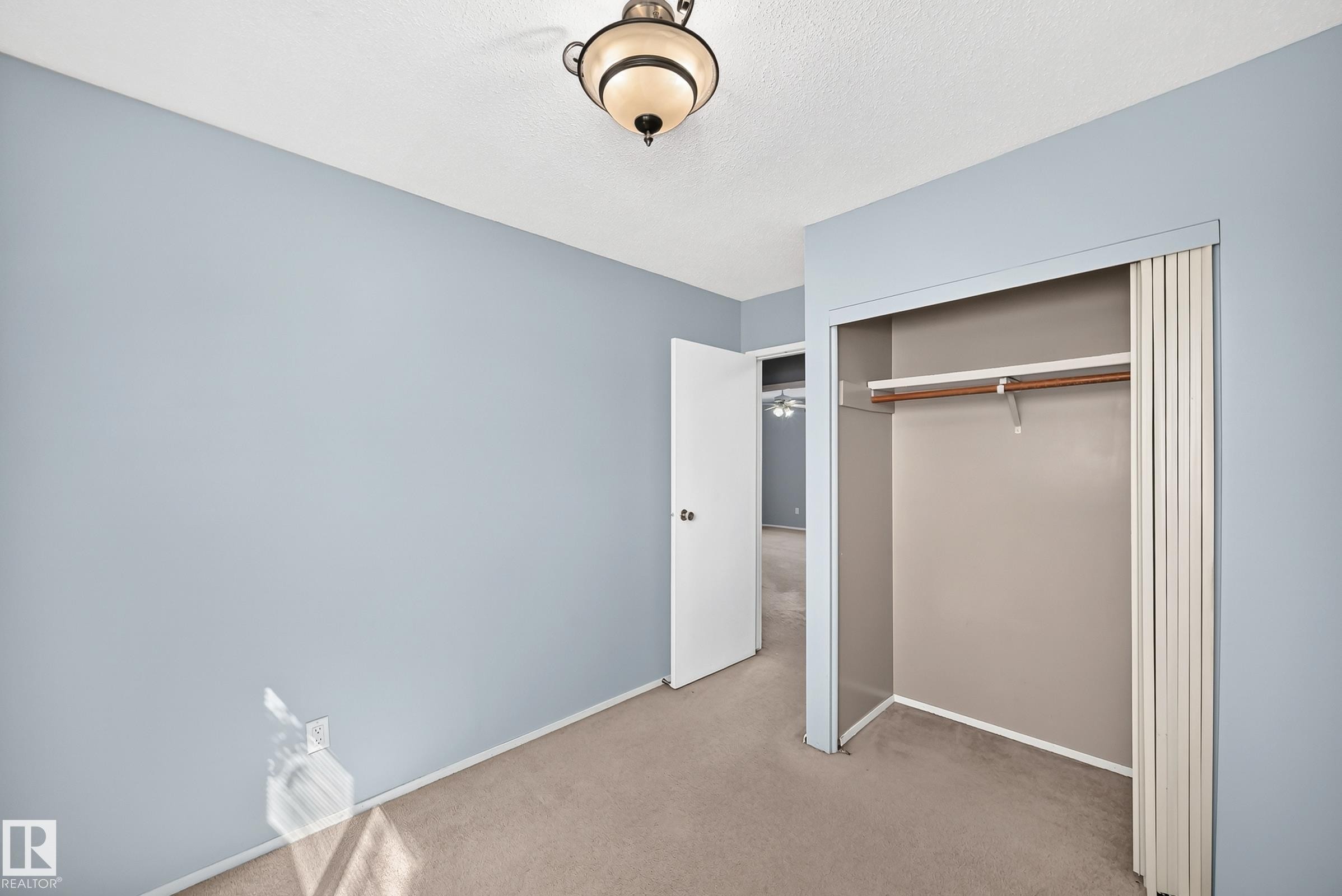 Room with soft blue walls and neutral carpeting - 355 Northgate Terrace, Edmonton, AB