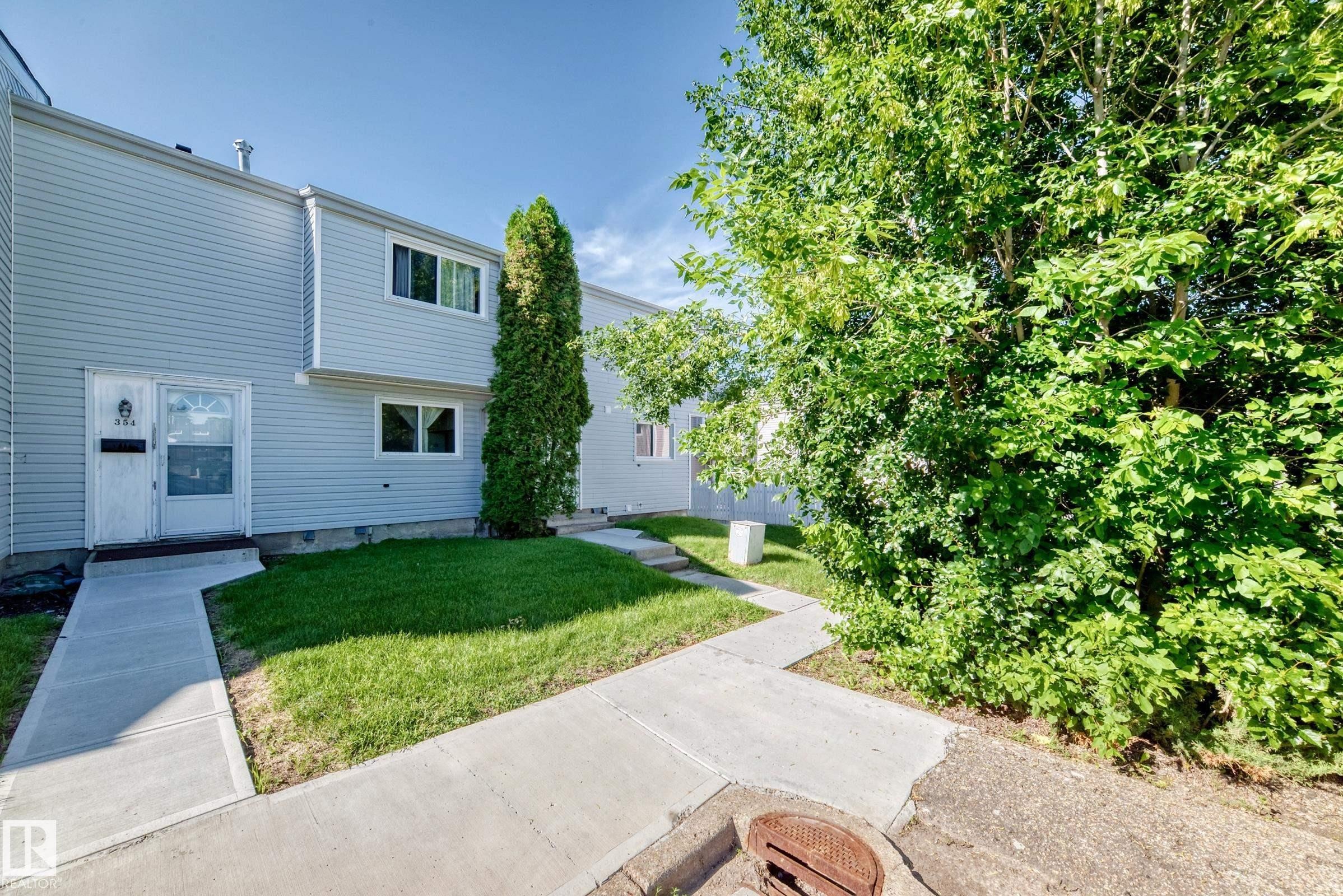 Light gray siding exterior with white window trim - 355 Northgate Terrace, Edmonton, AB