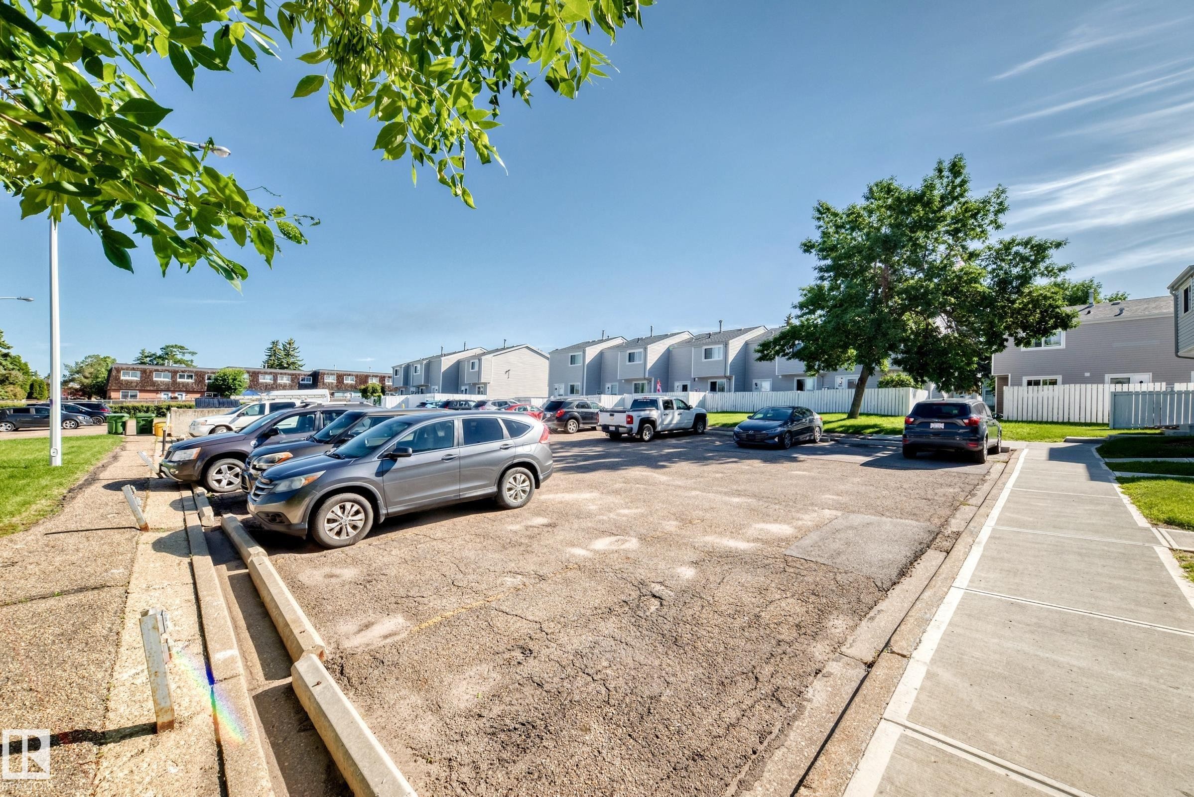 Asphalt parking area with concrete parking blocks - 355 Northgate Terrace, Edmonton, AB