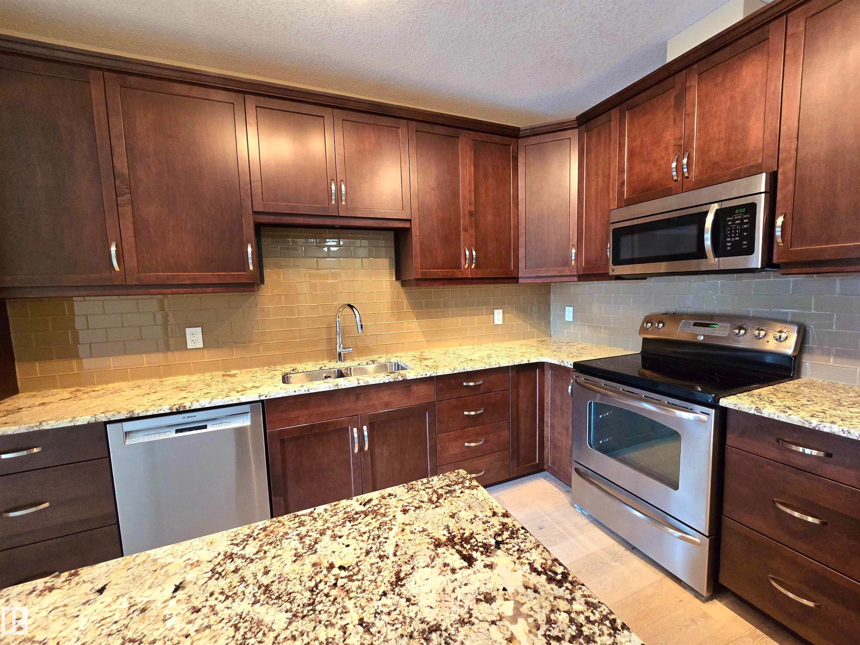 256 6079 Maynard Way, Edmonton, AB - Indoor Photo Showing Kitchen With Stainless Steel Kitchen With Double Sink