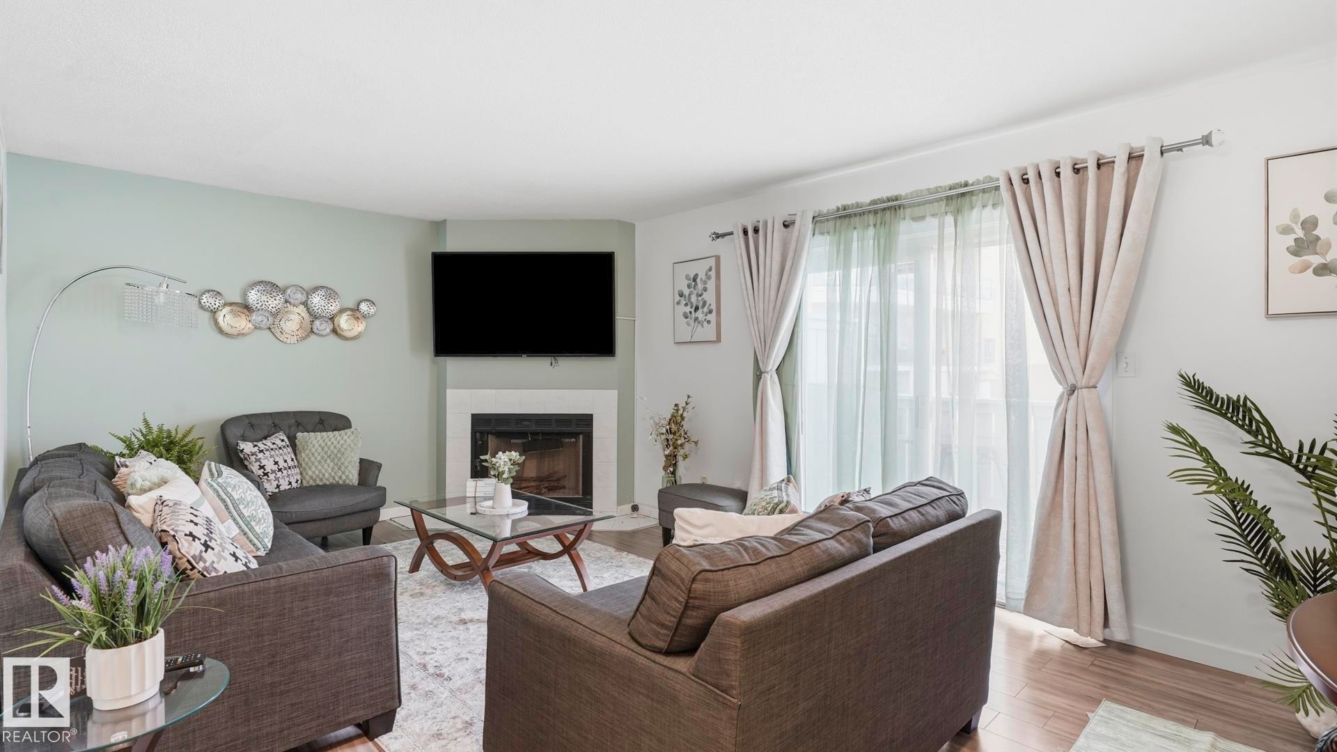 #17 9505 176 St Nw, Edmonton, AB - Indoor Photo Showing Living Room With Fireplace