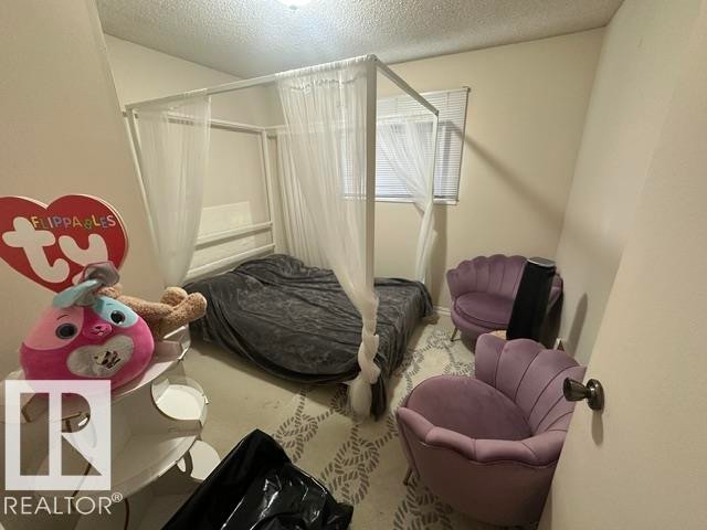 Interior room with light-colored walls and a window with blinds - 18020 96 Avenue, Edmonton, AB