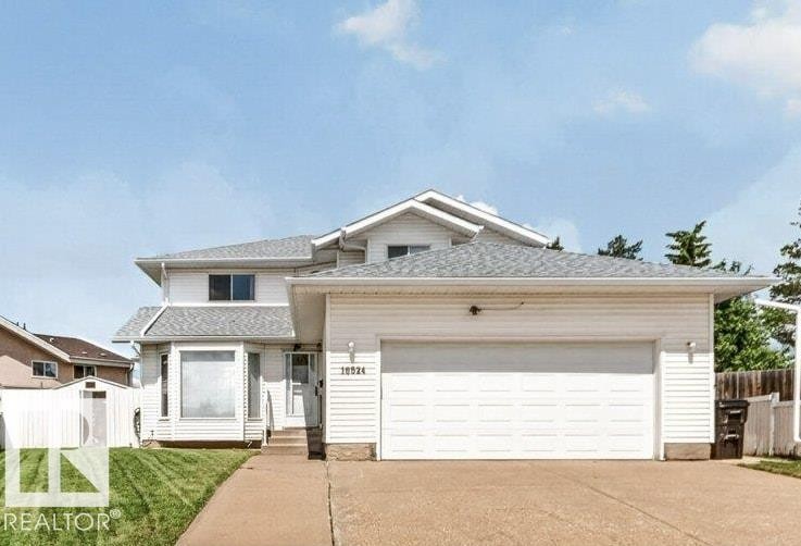 Two-story residence featuring white siding and a light gray shingle roof - 16524 99 Street Nw, Edmonton, AB - Outdoor