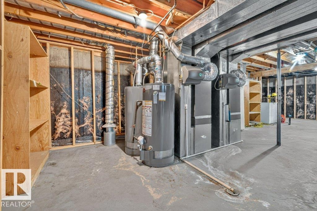 Unfinished basement space with exposed wooden joists and concrete flooring - 16524 99 Street Nw, Edmonton, AB - Indoor Photo Showing Basement