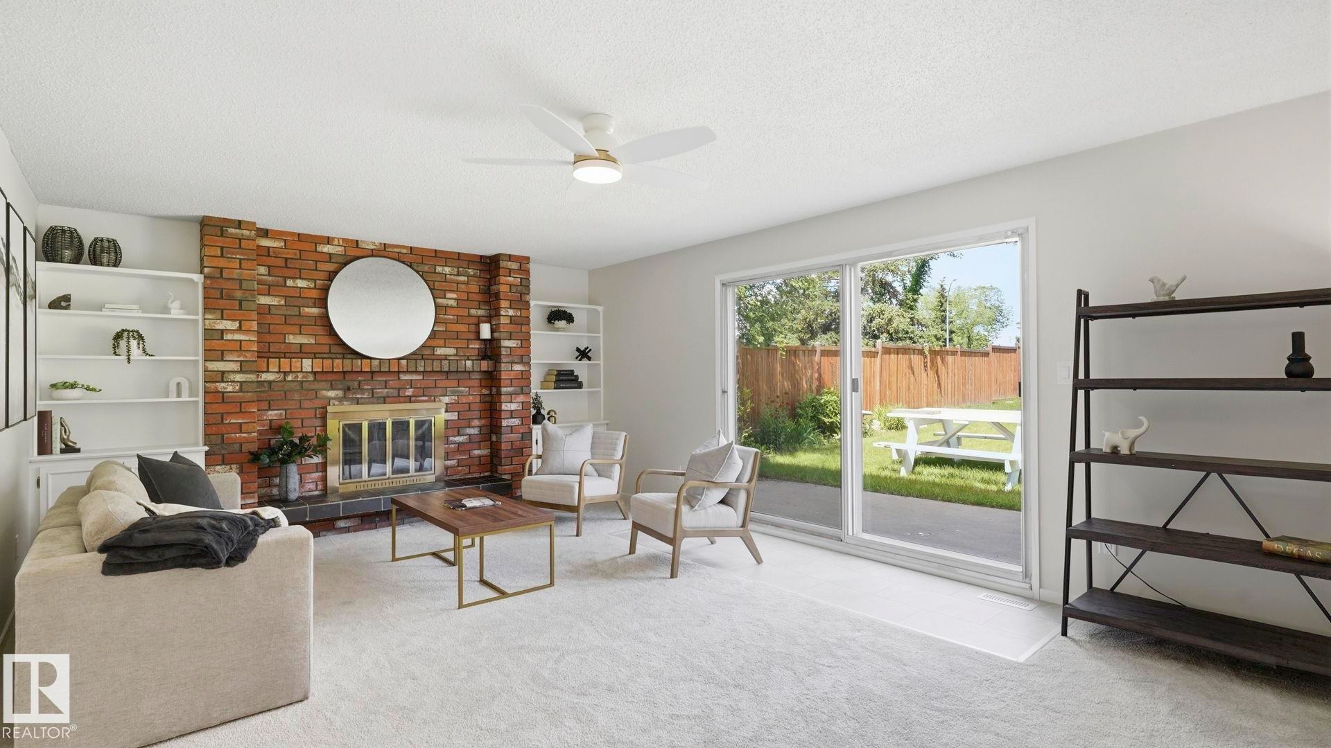 2723 83 Street Nw, Edmonton, AB - Indoor Photo Showing Living Room With Fireplace