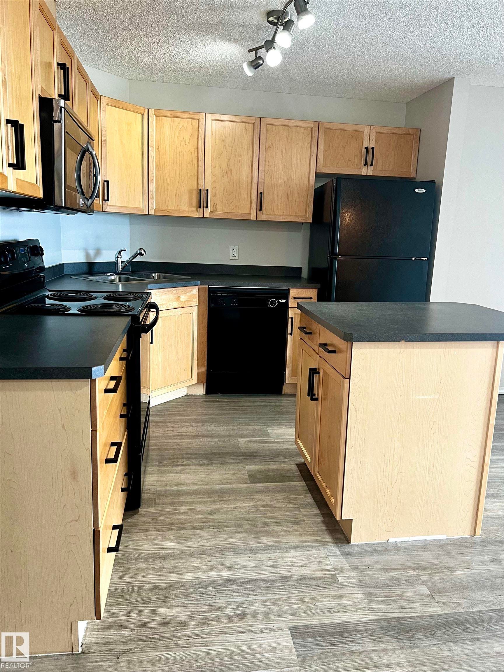 #411 5951 165 Av Nw, Edmonton, AB - Indoor Photo Showing Kitchen With Double Sink