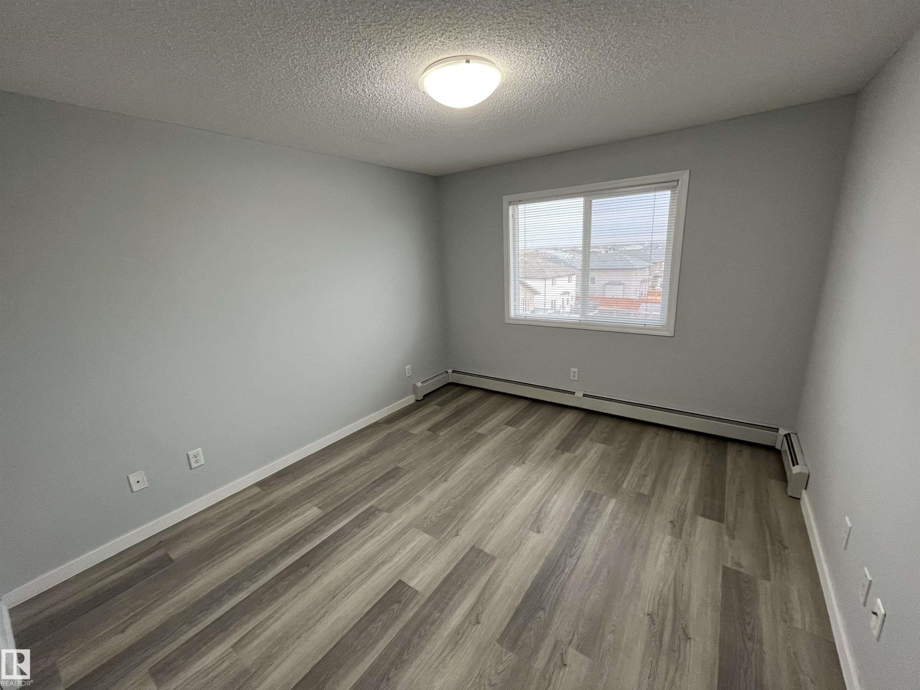 #411 5951 165 Av Nw, Edmonton, AB - Indoor Photo Showing Other Room