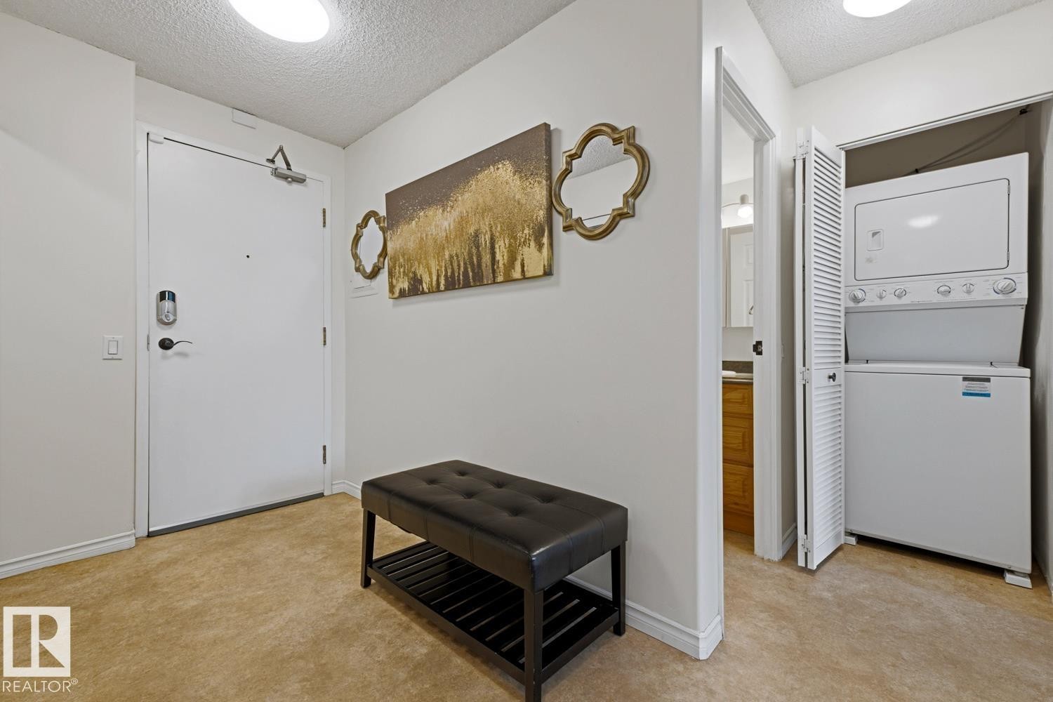 Entryway featuring a white door with a digital lock and a ceiling-mounted light fixture - 505 10145 109 Street, Edmonton, AB