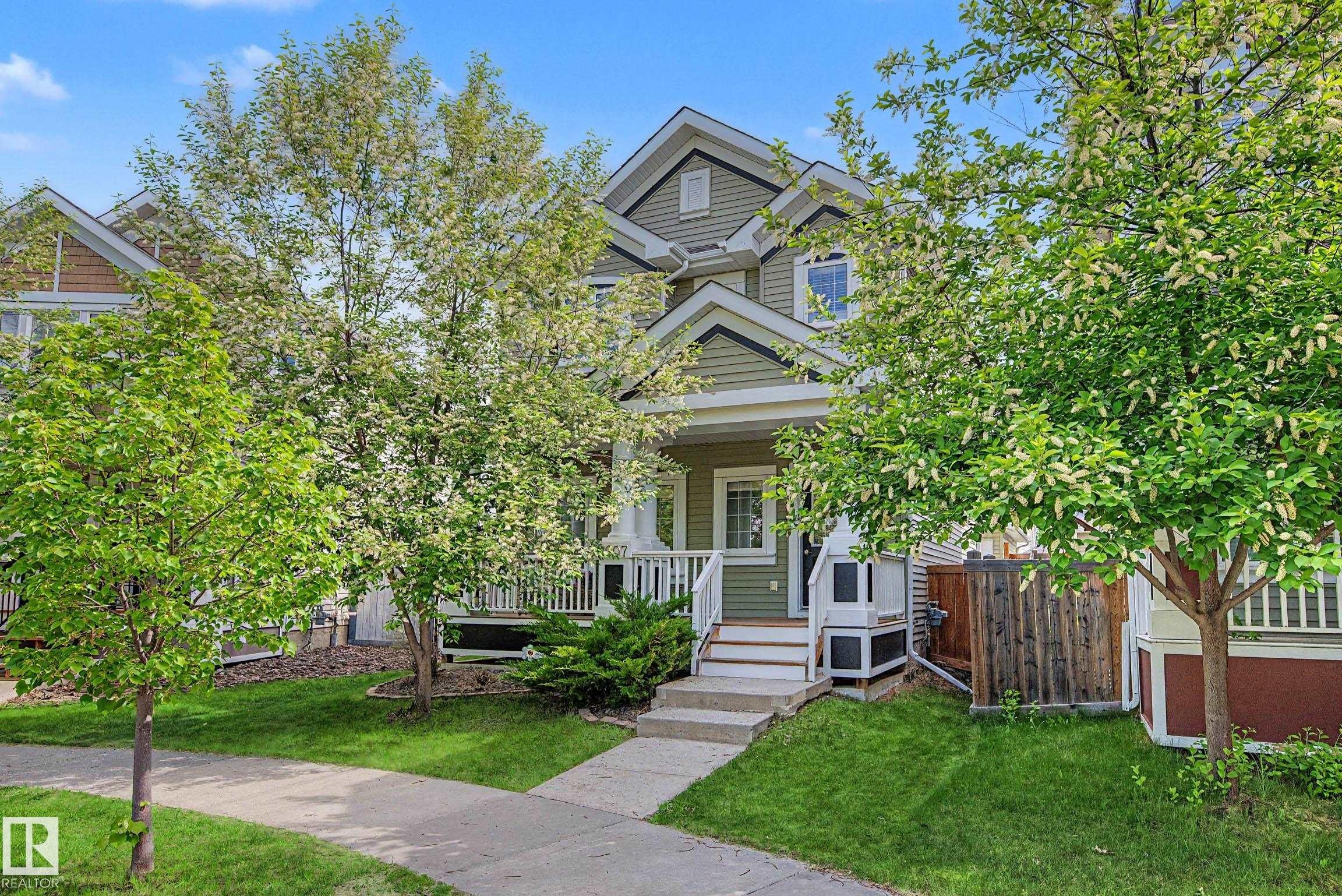 Two-story home with light green siding and white trim - 2007 72 Street, Edmonton, AB - Outdoor