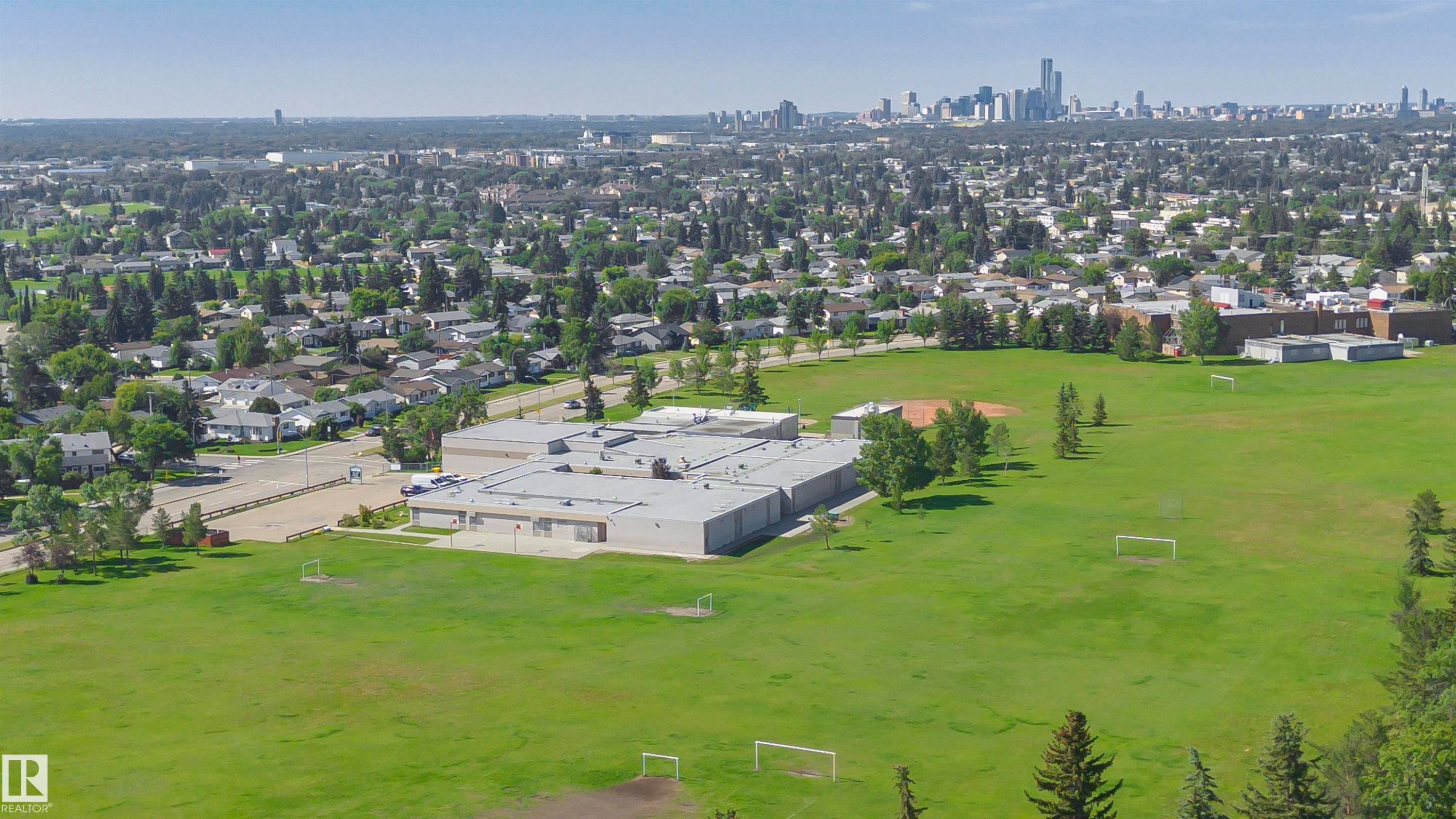 Expansive green space featuring athletic fields and mature trees - 5418 144B Avenue, Edmonton, AB
