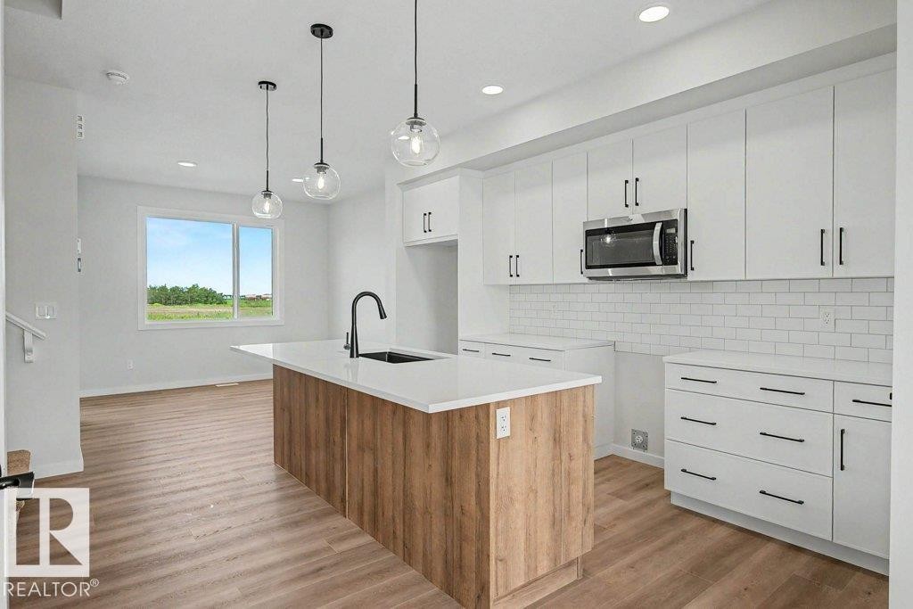 400 Stiles Way, Leduc, AB - Indoor Photo Showing Kitchen With Upgraded Kitchen