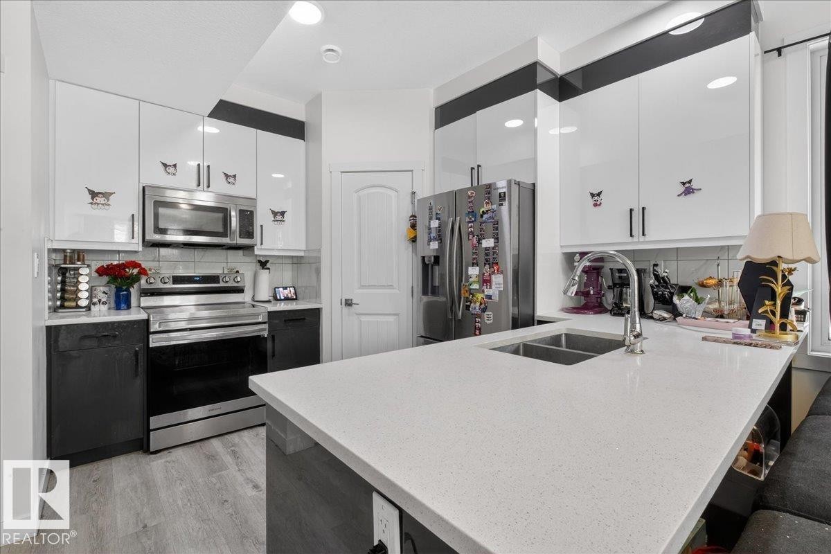 #1 11616 82 St Nw, Edmonton, AB - Indoor Photo Showing Kitchen With Double Sink With Upgraded Kitchen