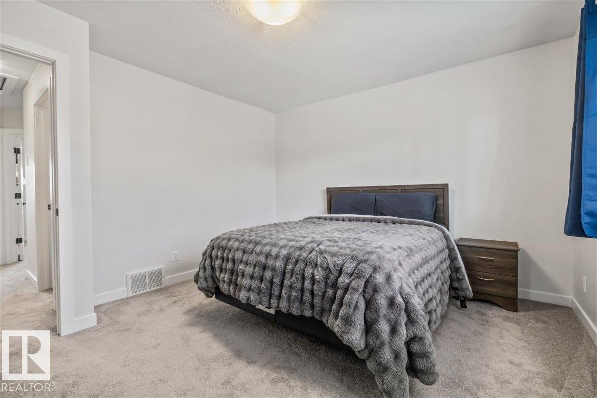 Spacious room featuring light gray carpet flooring and white walls - 125 Birchwood Close, Devon, AB