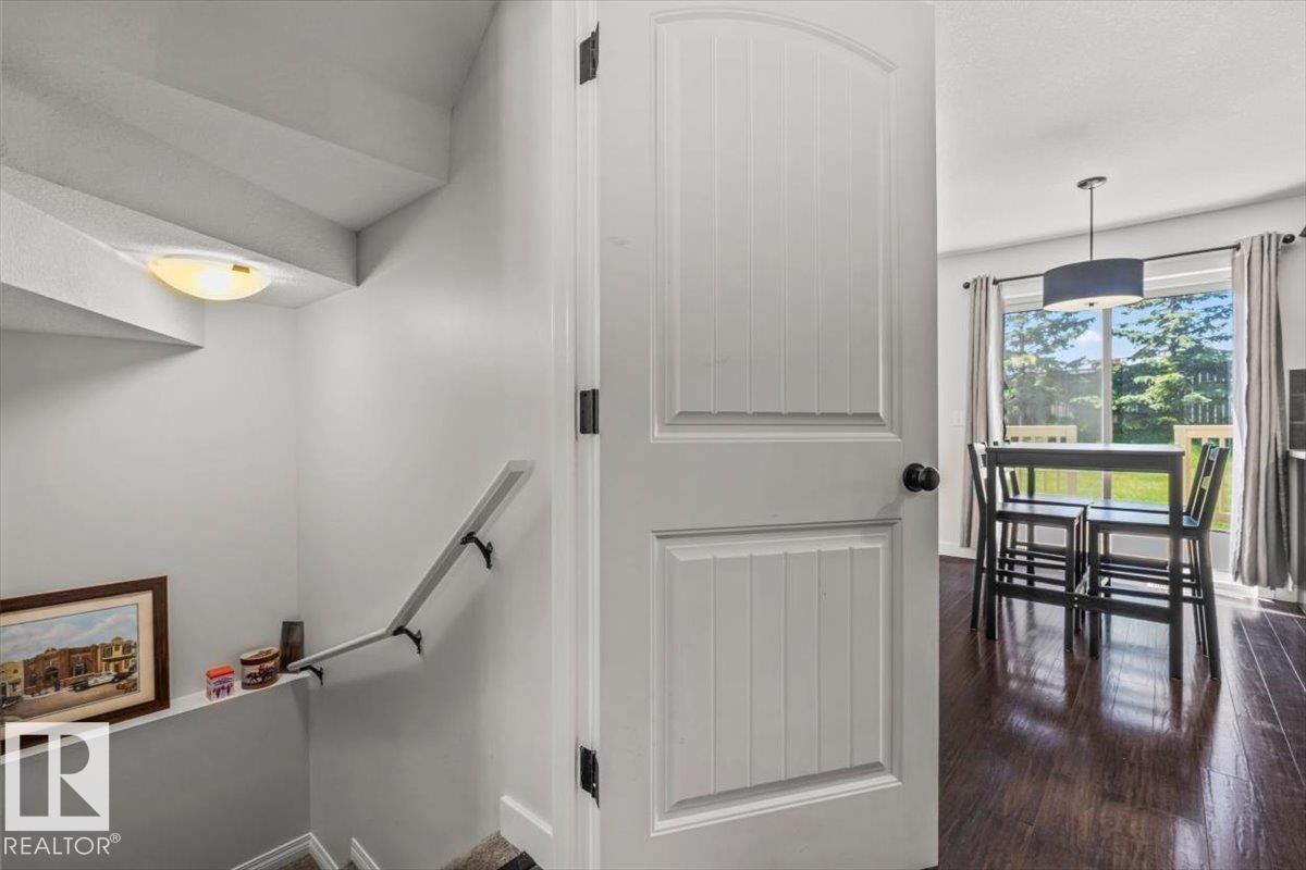 Interior white paneled door with matte black hardware - 125 Birchwood Close, Devon, AB