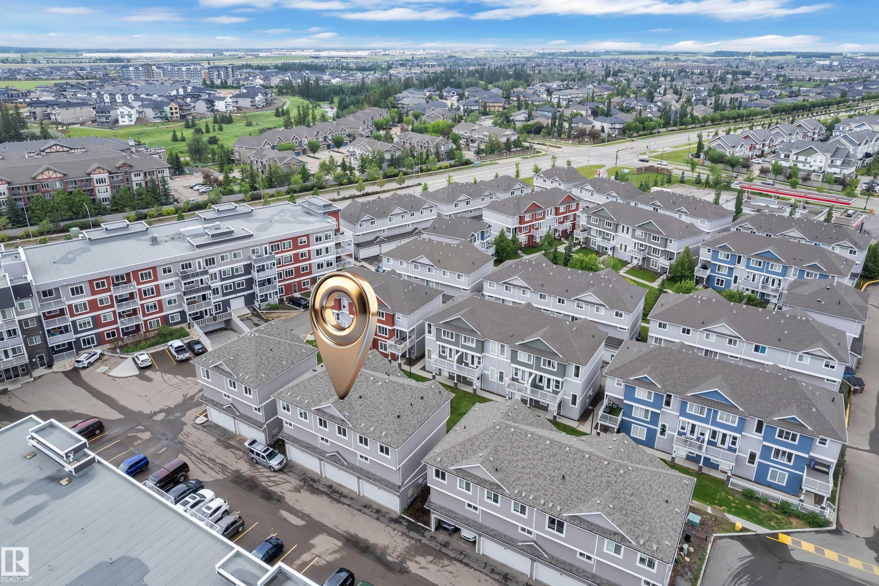 Aerial perspective showcasing a residential development with multiple townhome-style units - #82 1816 Rutherford Rd Sw, Edmonton, AB - Outdoor With View