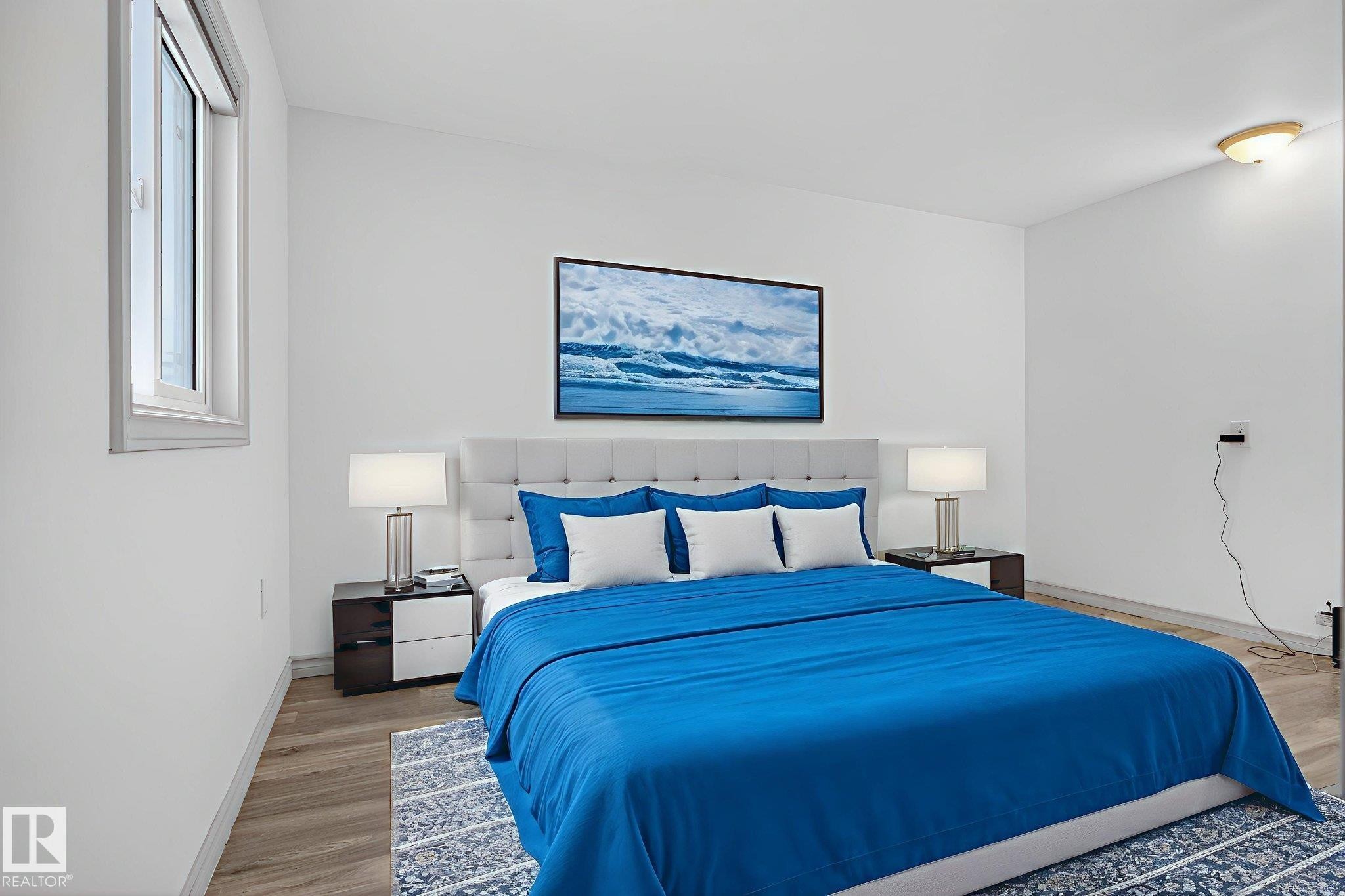 Bedroom featuring light wood-finish flooring, white walls, and a single window with white framing - 543 Evergreen Park Northwest, Edmonton, AB - Indoor Photo Showing Bedroom