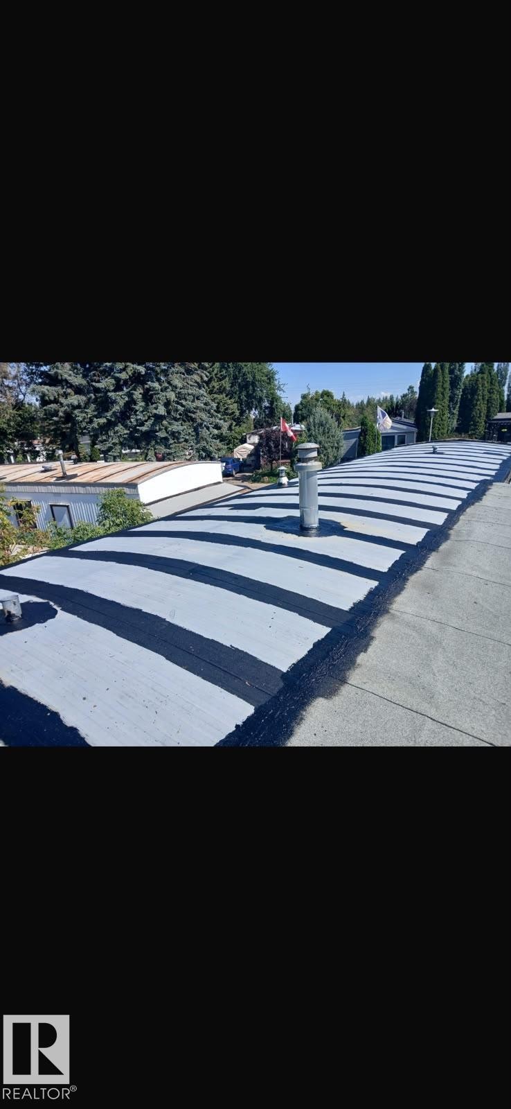 Pitched roof with gray and black roofing material and a single vent pipe - 543 Evergreen Park Northwest, Edmonton, AB - Outdoor With View
