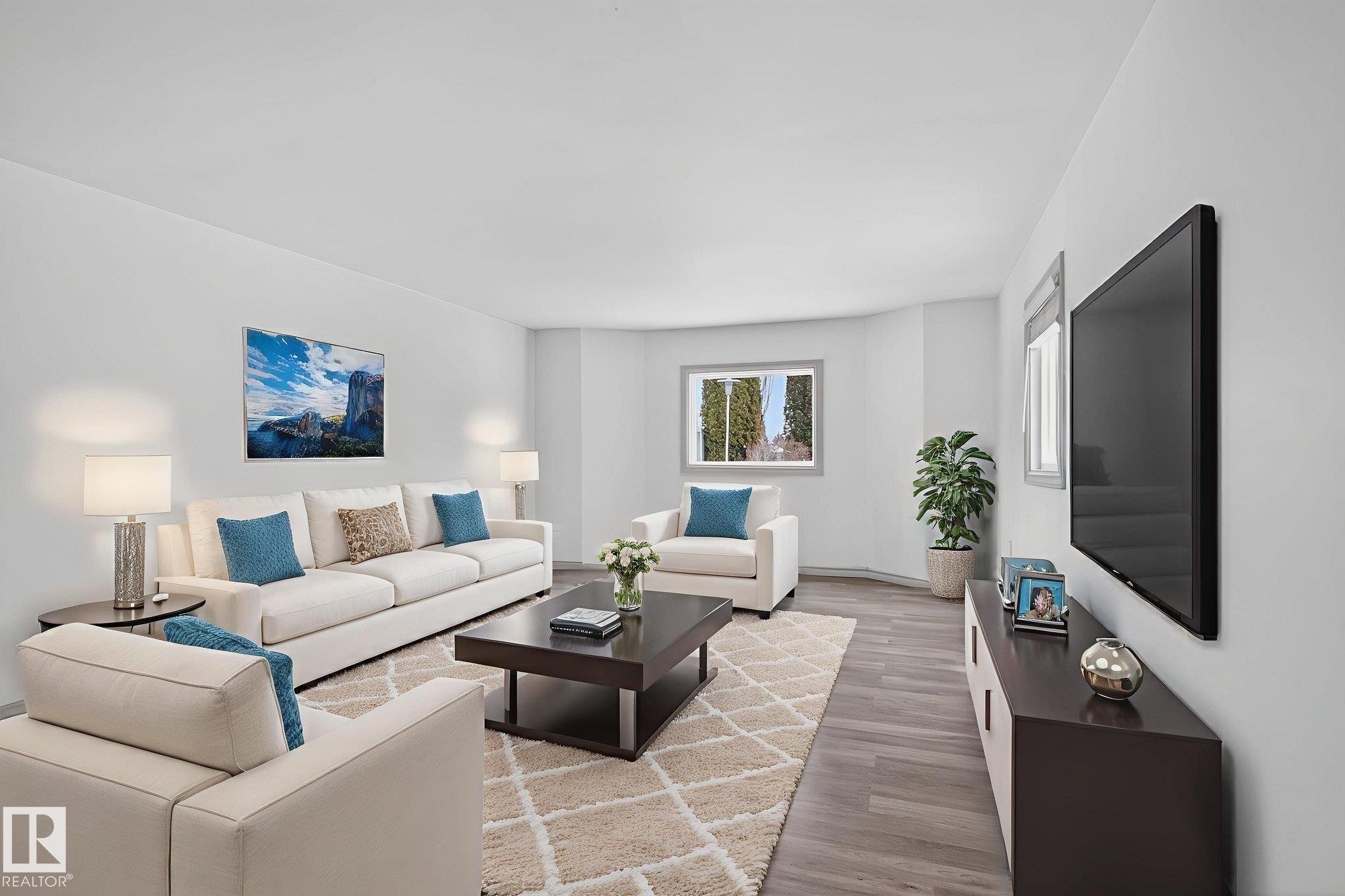 Spacious living area featuring light wood-finish flooring and neutral wall tones - 543 Evergreen Park Northwest, Edmonton, AB - Indoor Photo Showing Living Room