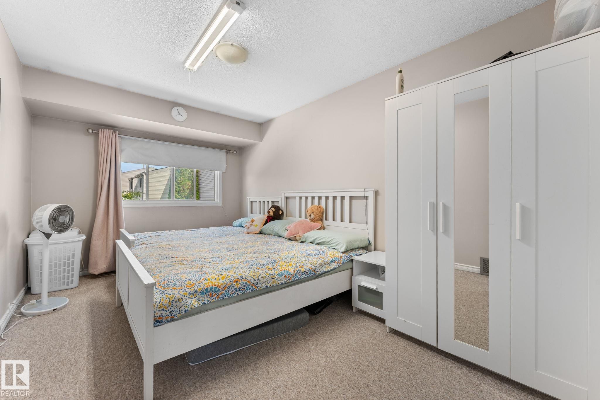 Neutral-toned walls complement the carpeted flooring and white window trim - 359 Northgate Terrace, Edmonton, AB