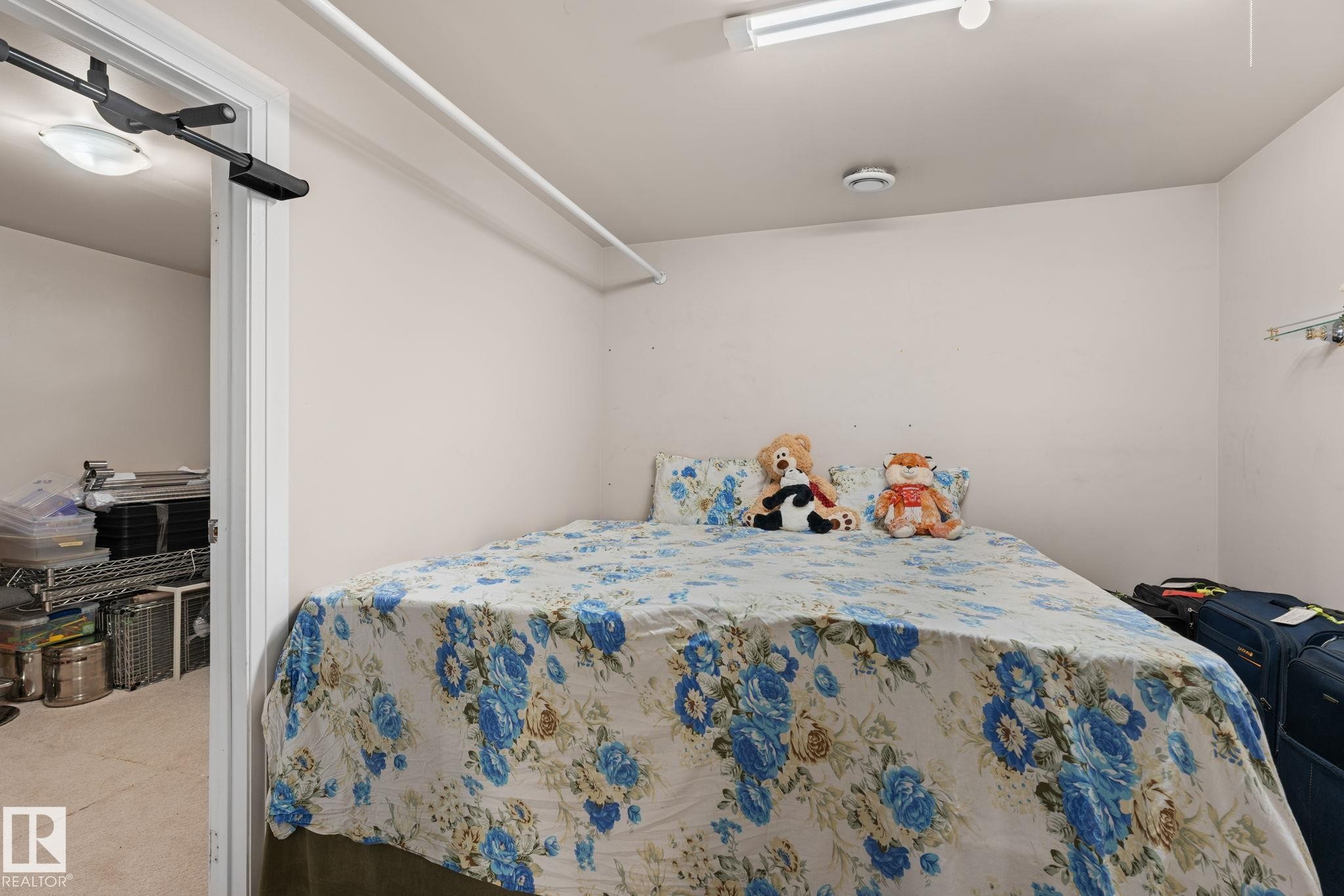 Bedroom space featuring light-colored walls and carpet flooring - 359 Northgate Terrace, Edmonton, AB