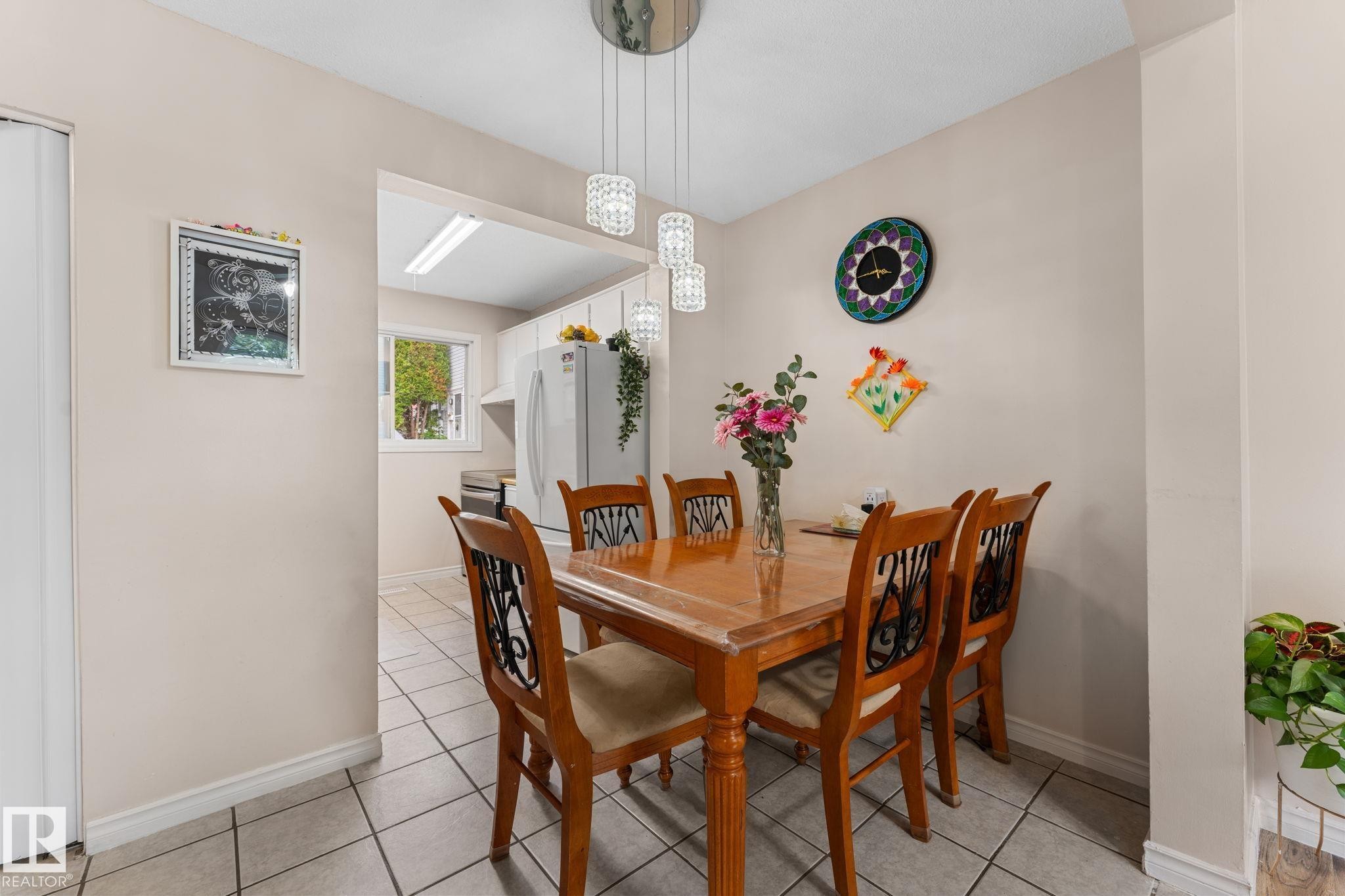 Dining area featuring light-toned walls and tile flooring - 359 Northgate Terrace, Edmonton, AB