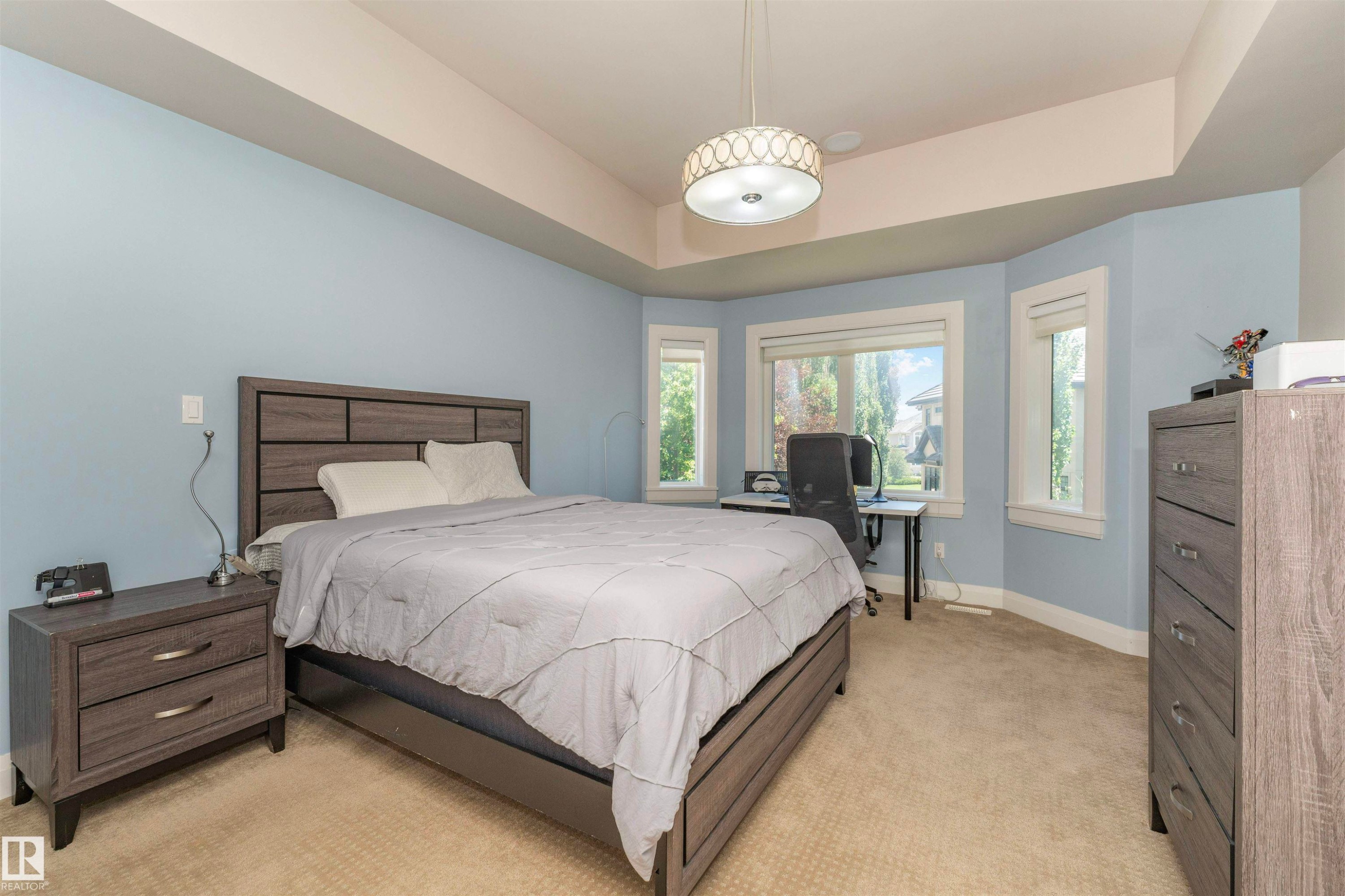 Bedroom featuring a bay window with multiple panes, light blue wall paint, and recessed lighting - 3503 Watson Point(E), Edmonton, AB
