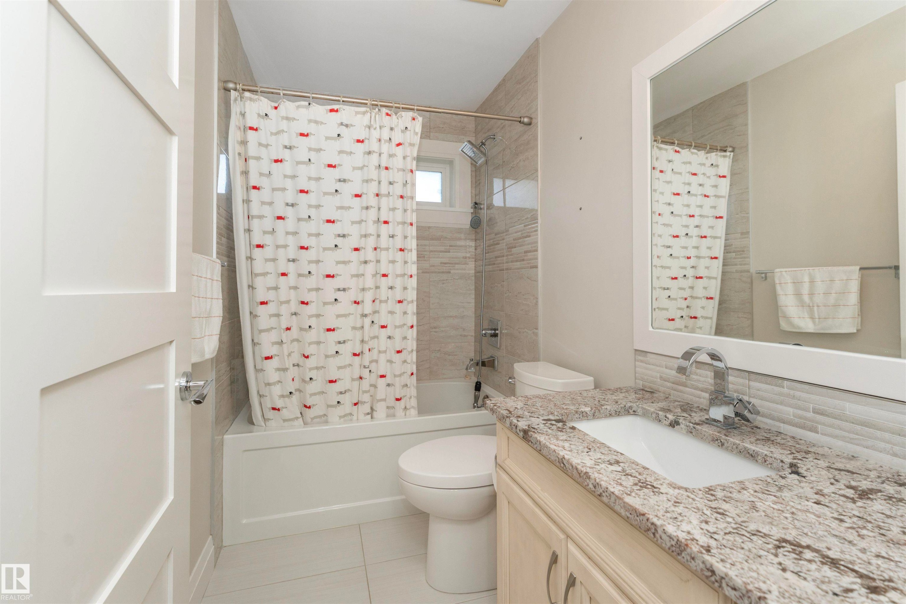 Bathroom featuring a vanity with a granite countertop, undermount sink, and chrome faucet - 3503 Watson Point(E), Edmonton, AB