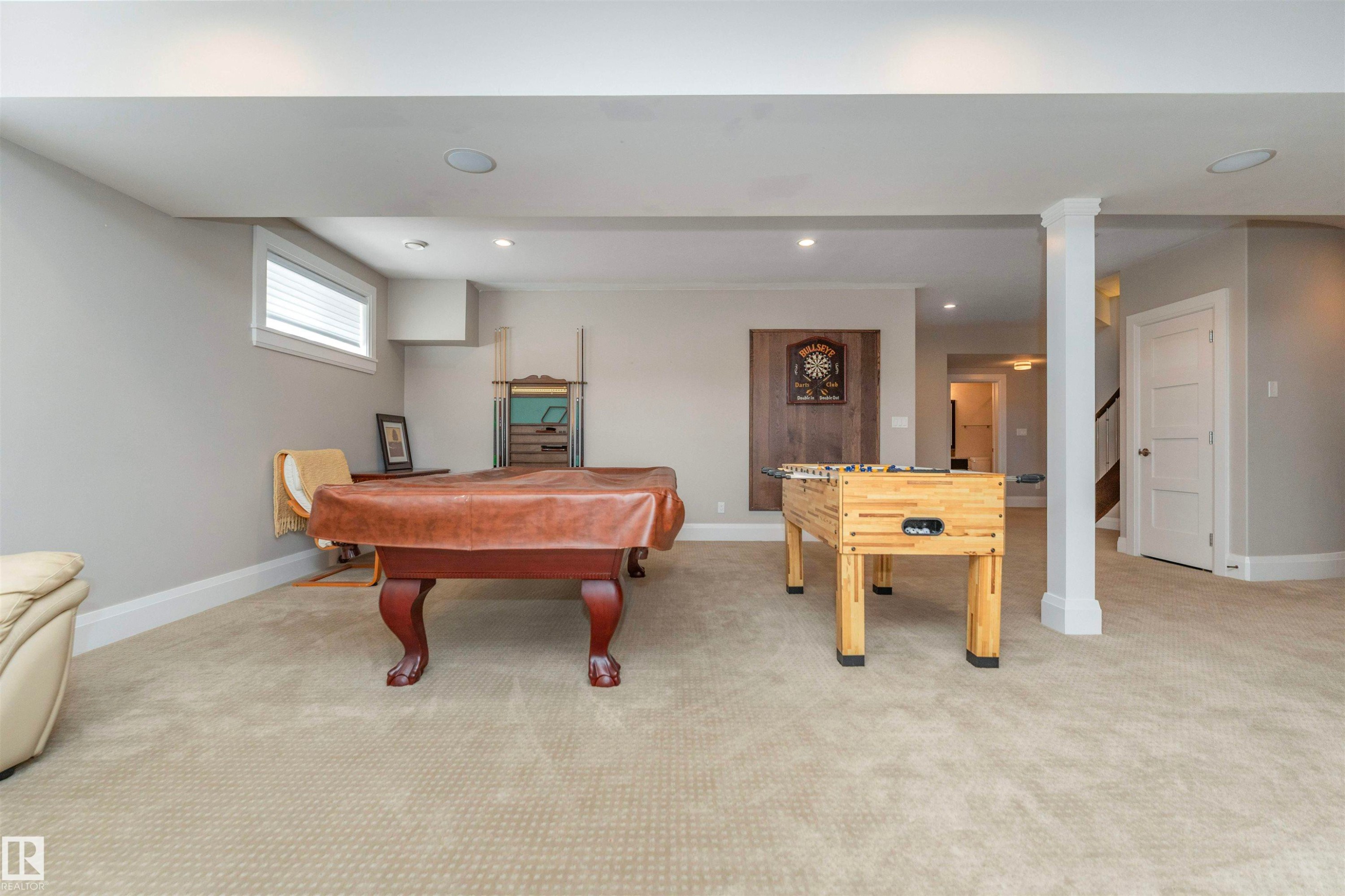 Finished lower level with neutral carpeting, recessed lighting, and a visible window with blinds - 3503 Watson Point(E), Edmonton, AB