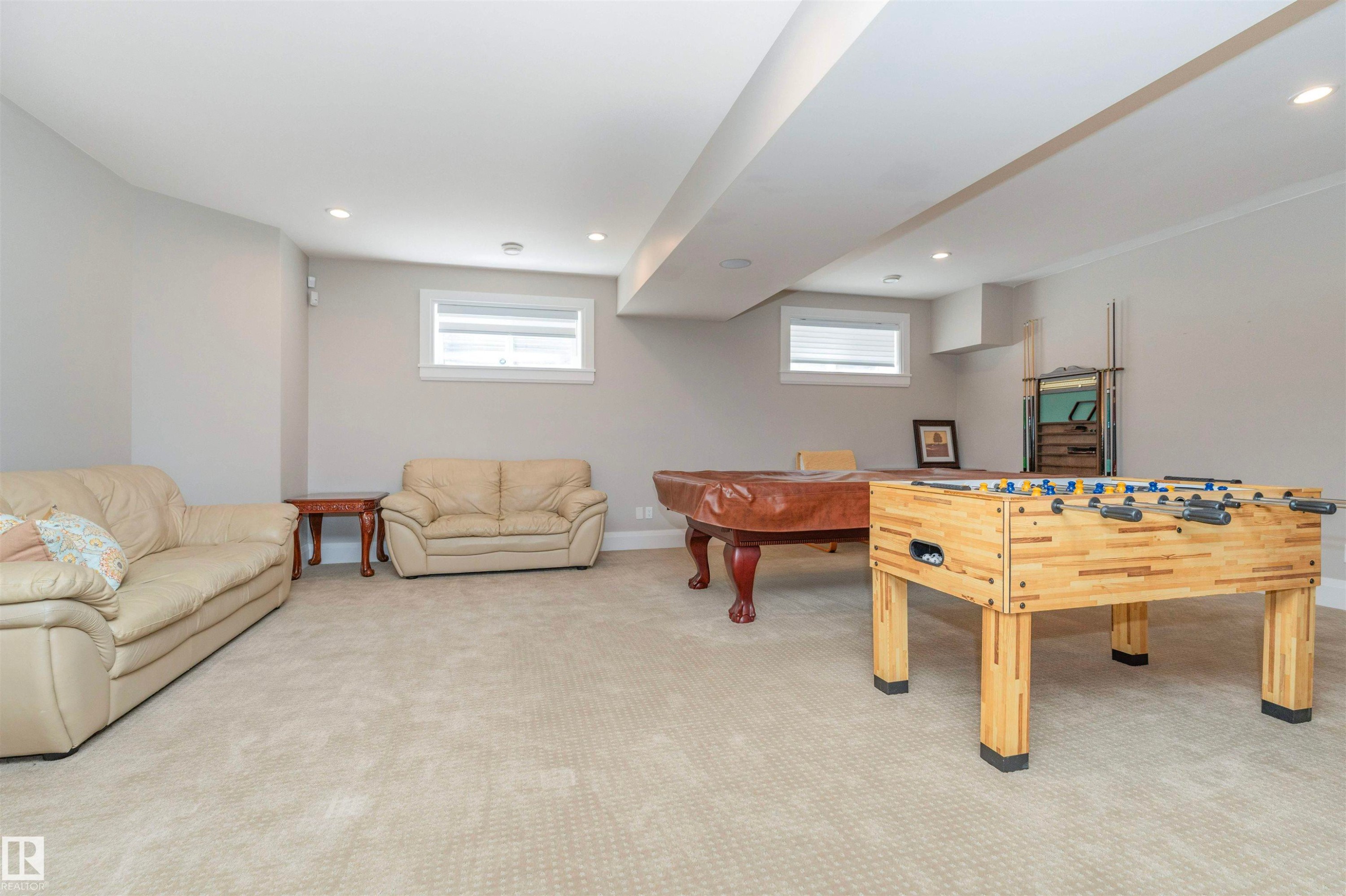 Spacious recreational area featuring light-colored carpeting, neutral painted walls, and recessed lighting - 3503 Watson Point(E), Edmonton, AB