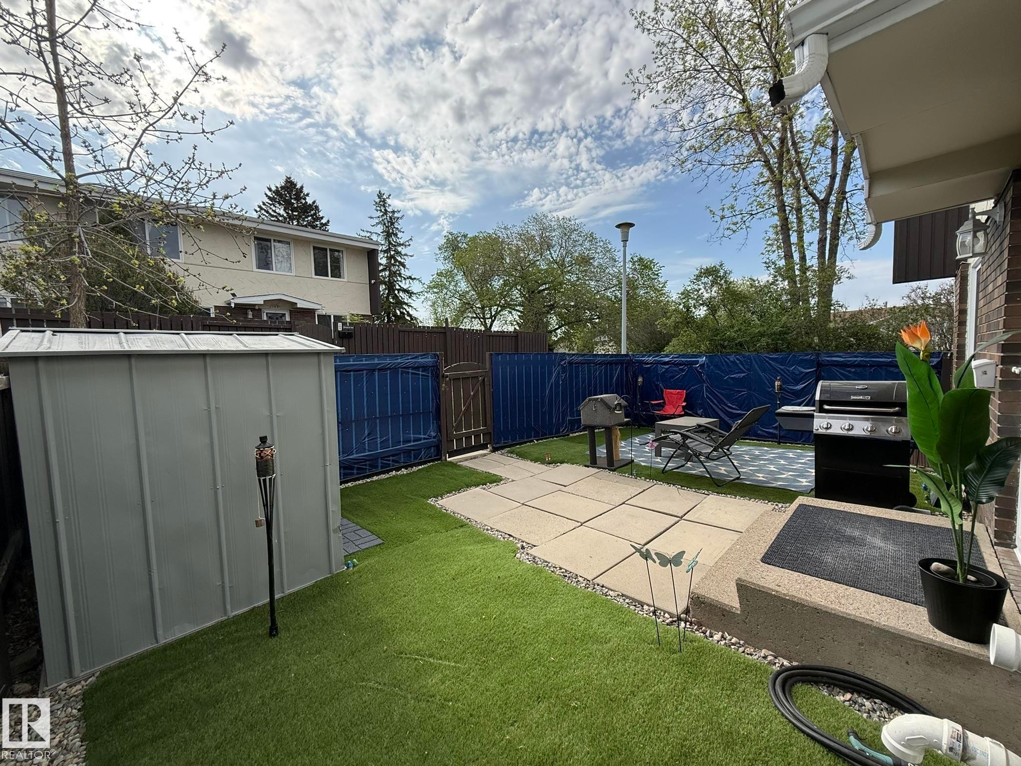 SUCH A LARGE FRONT YARD WITH GREAT PRIVACY AND A SHED INCLUDED! - 166 Roseland Village, Edmonton, AB - Outdoor