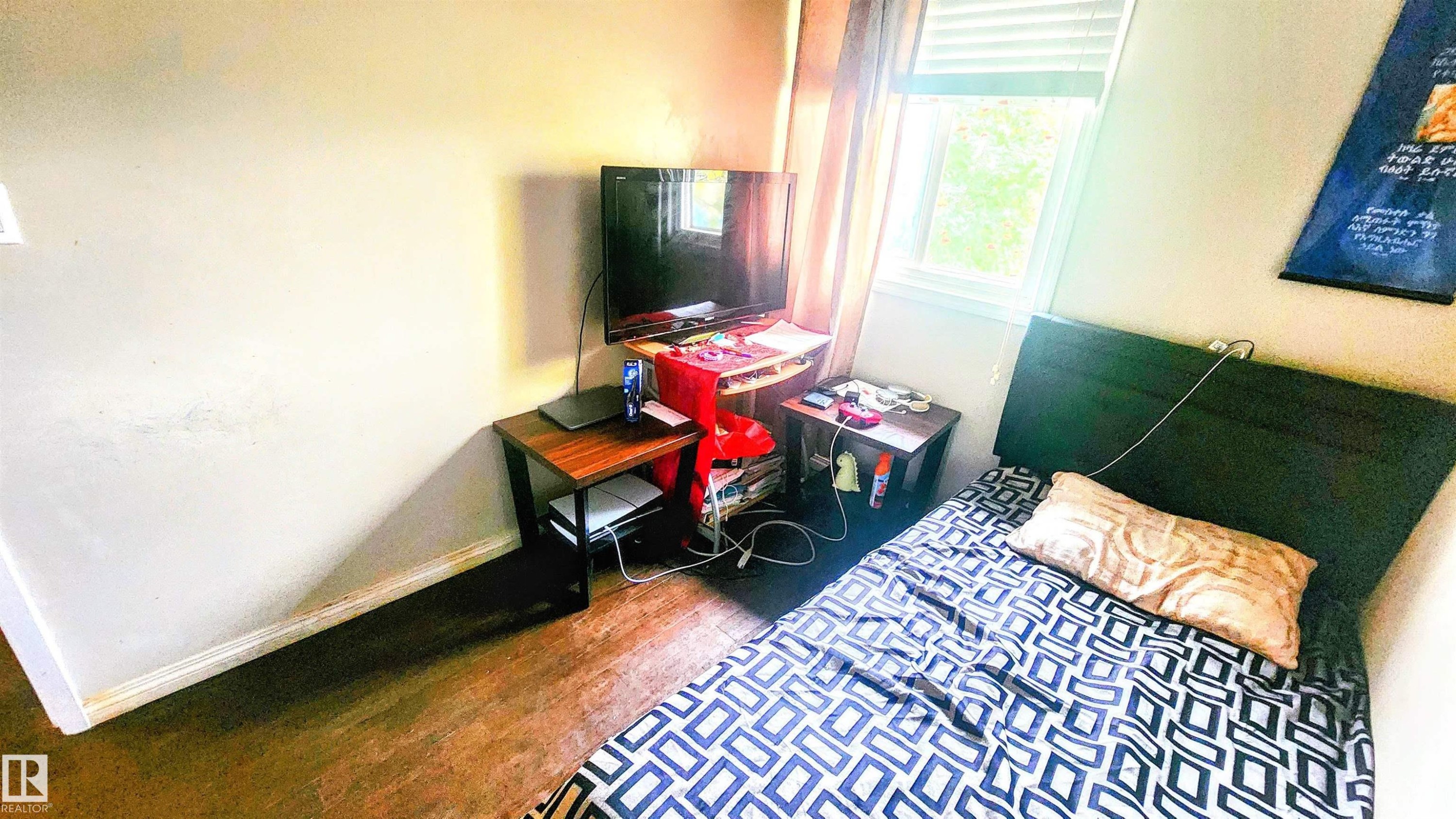 Bedroom with baseboards and wood finished floors - 704 Abbottsfield Road, Edmonton, AB - Indoor