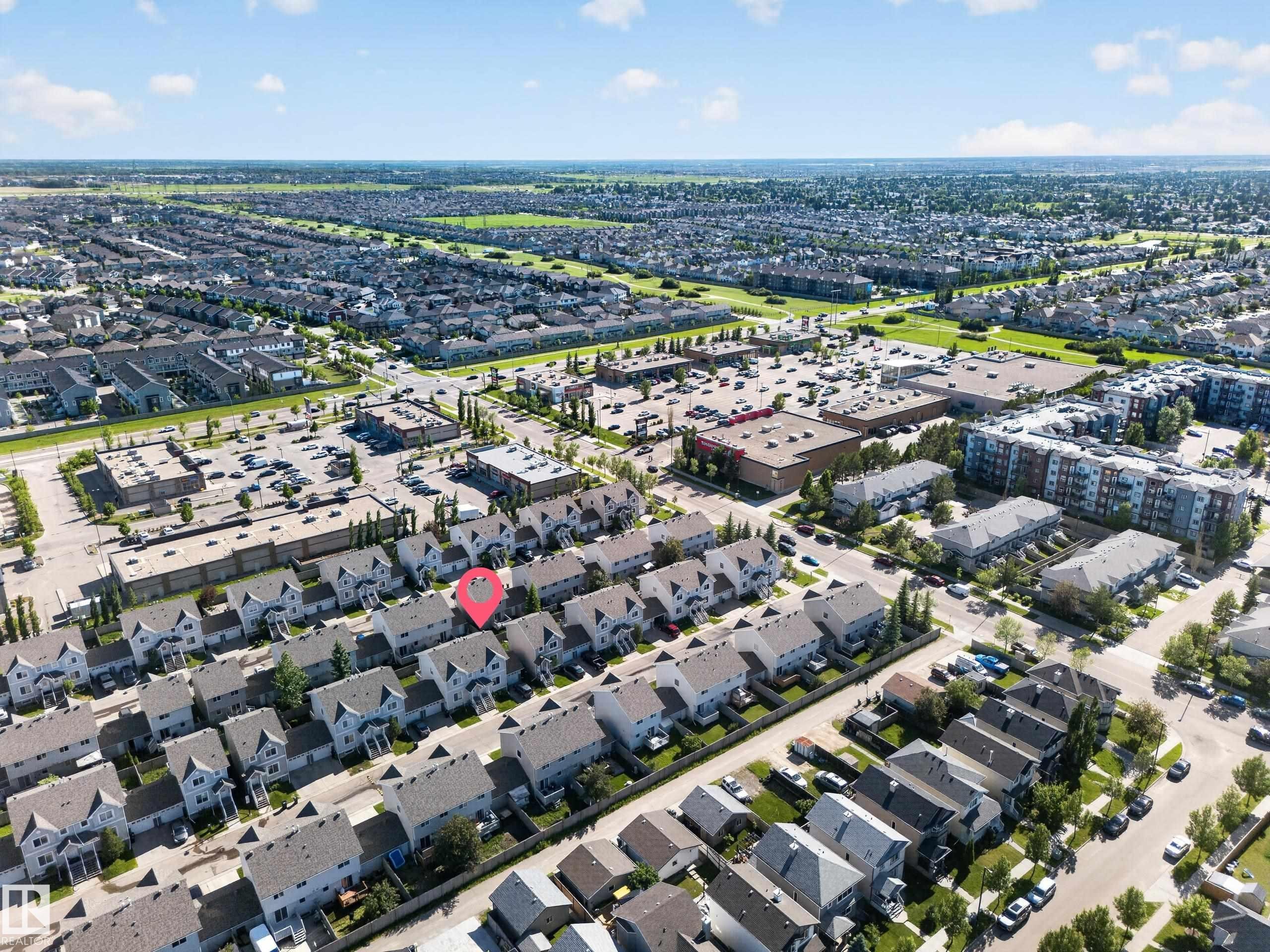 Aerial perspective of a developed residential area featuring a high density of detached homes, townhouses, and apartment buildings - 59 2503 24 Street, Edmonton, AB