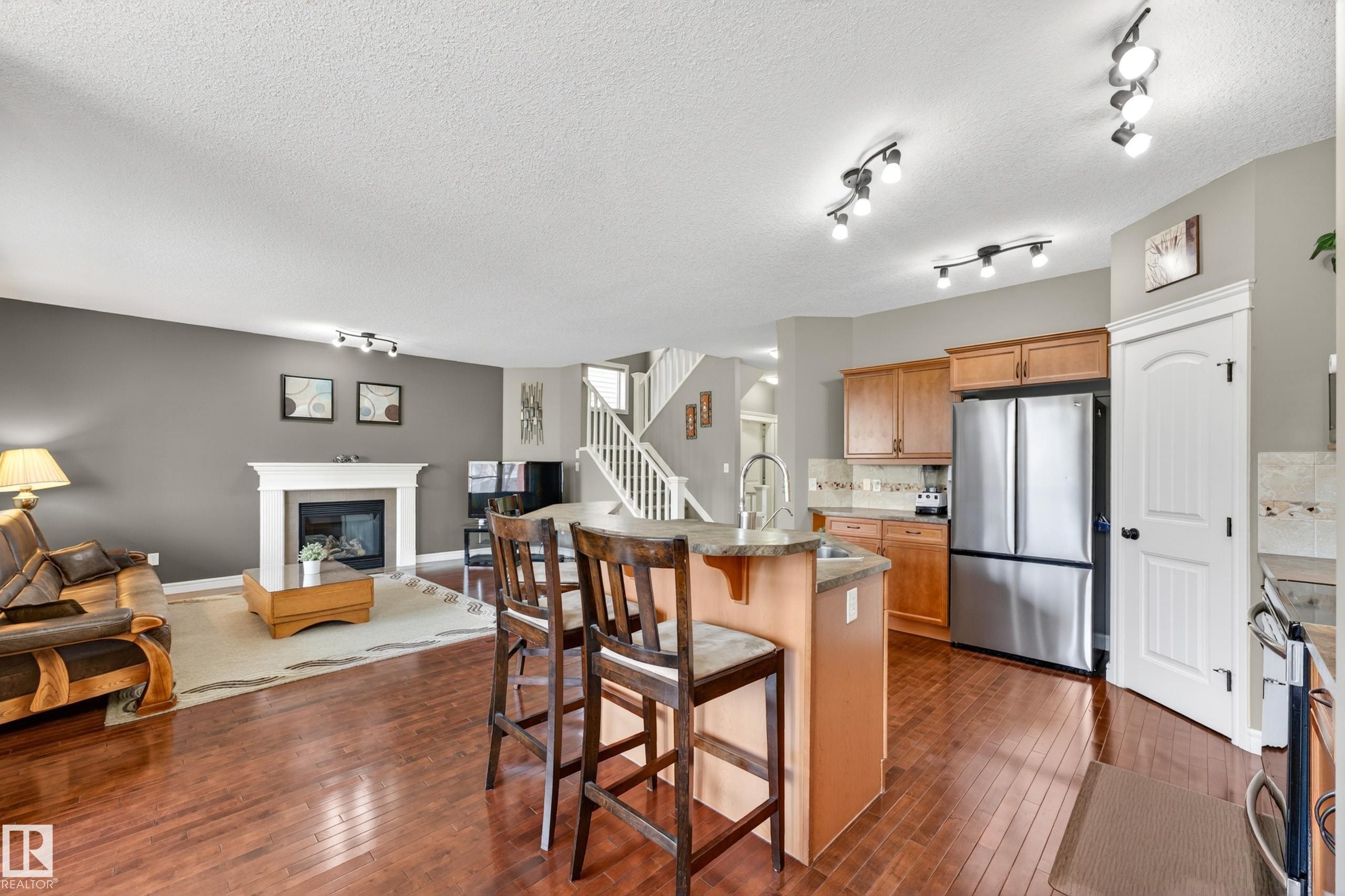 506 Adams Way Sw, Edmonton, AB - Indoor Photo Showing Kitchen With Fireplace