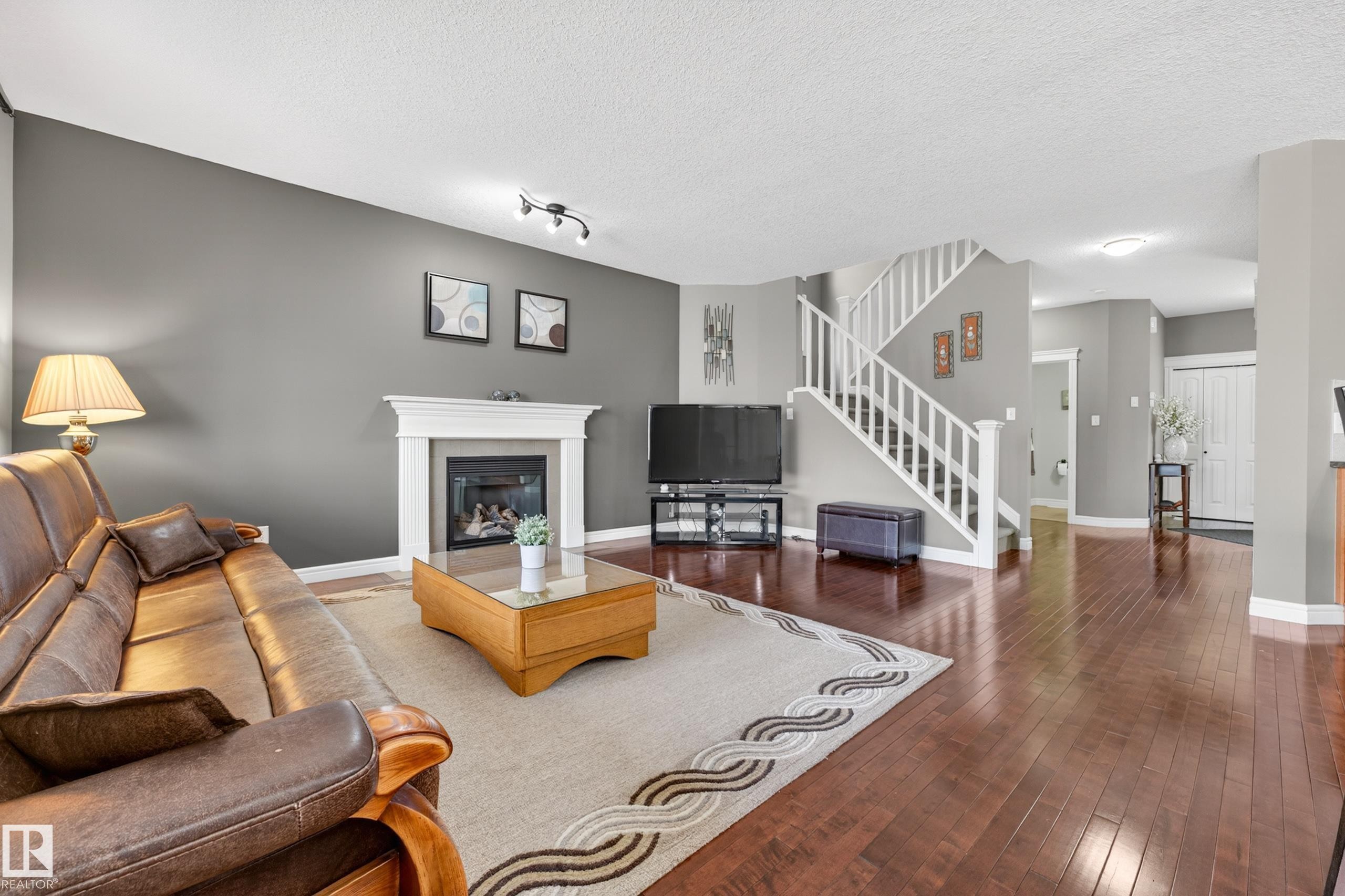 506 Adams Way Sw, Edmonton, AB - Indoor Photo Showing Living Room With Fireplace