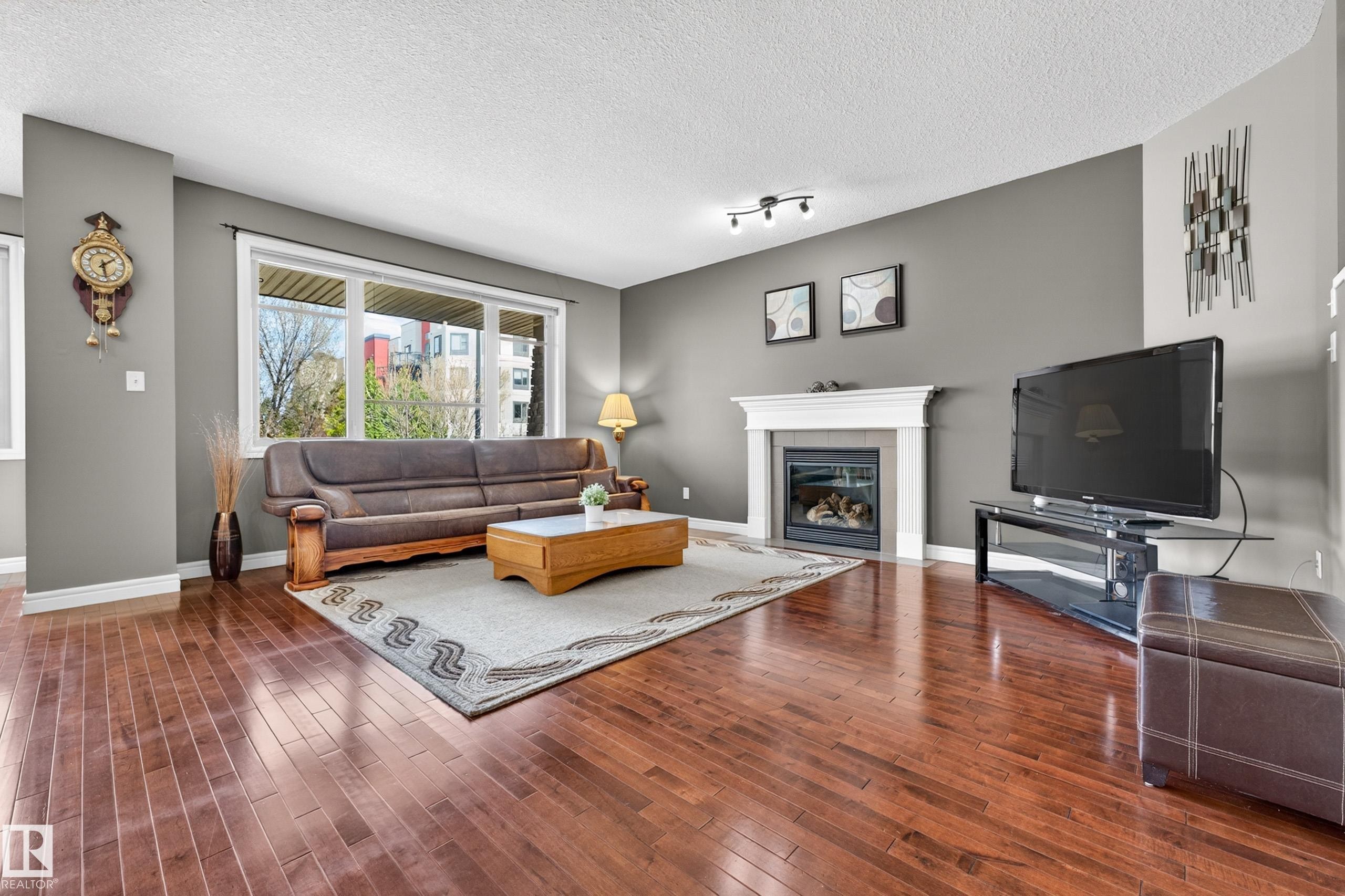 506 Adams Way Sw, Edmonton, AB - Indoor Photo Showing Living Room With Fireplace