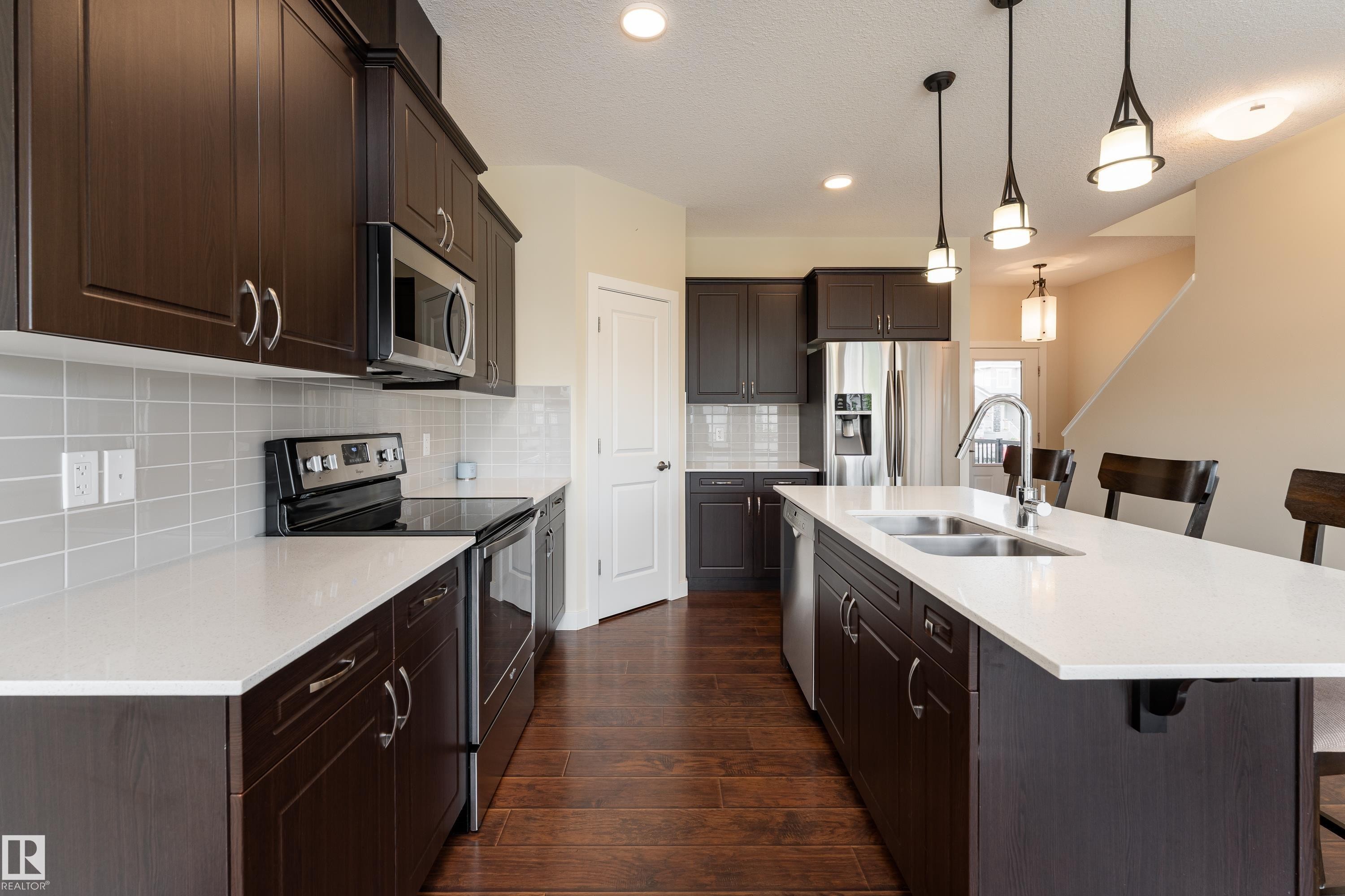 8589 Cushing Place Sw, Edmonton, AB - Indoor Photo Showing Kitchen With Stainless Steel Kitchen With Double Sink With Upgraded Kitchen
