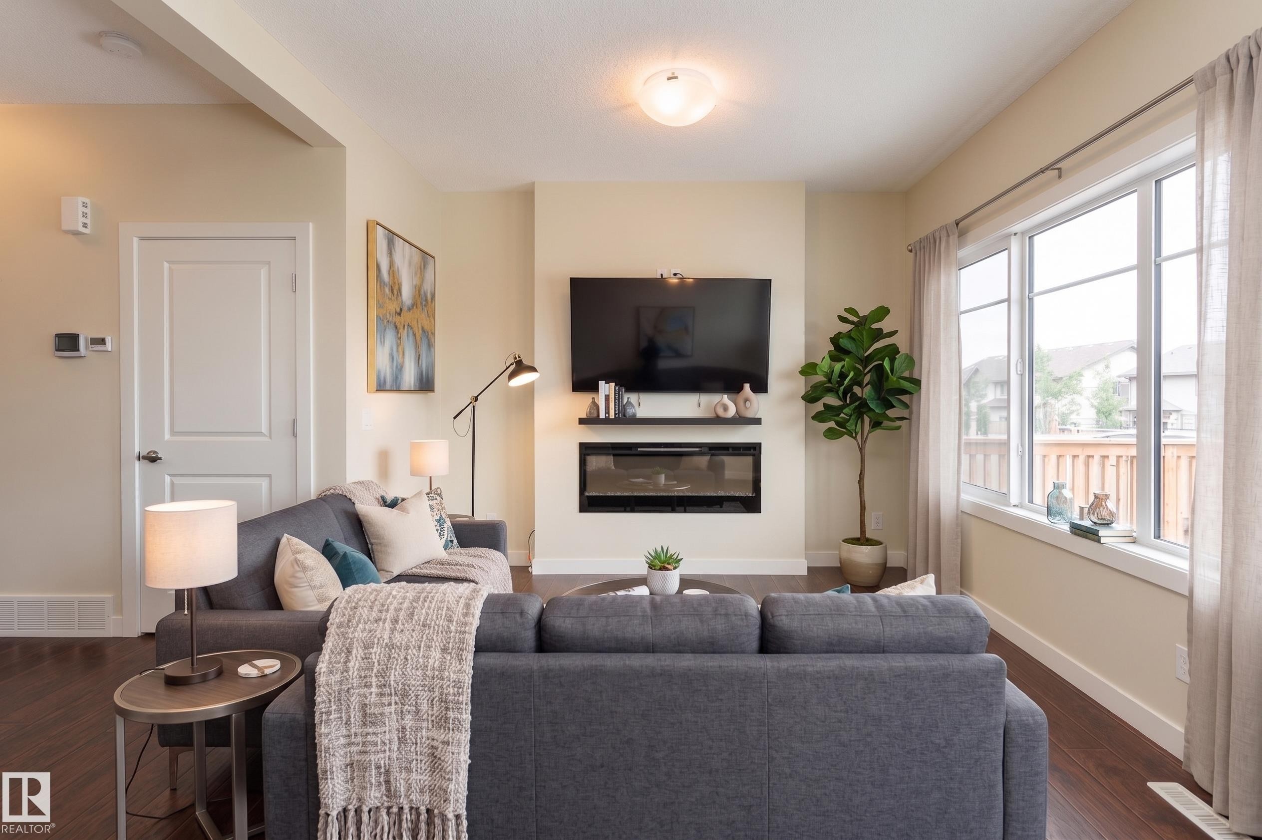8589 Cushing Place Sw, Edmonton, AB - Indoor Photo Showing Living Room With Fireplace