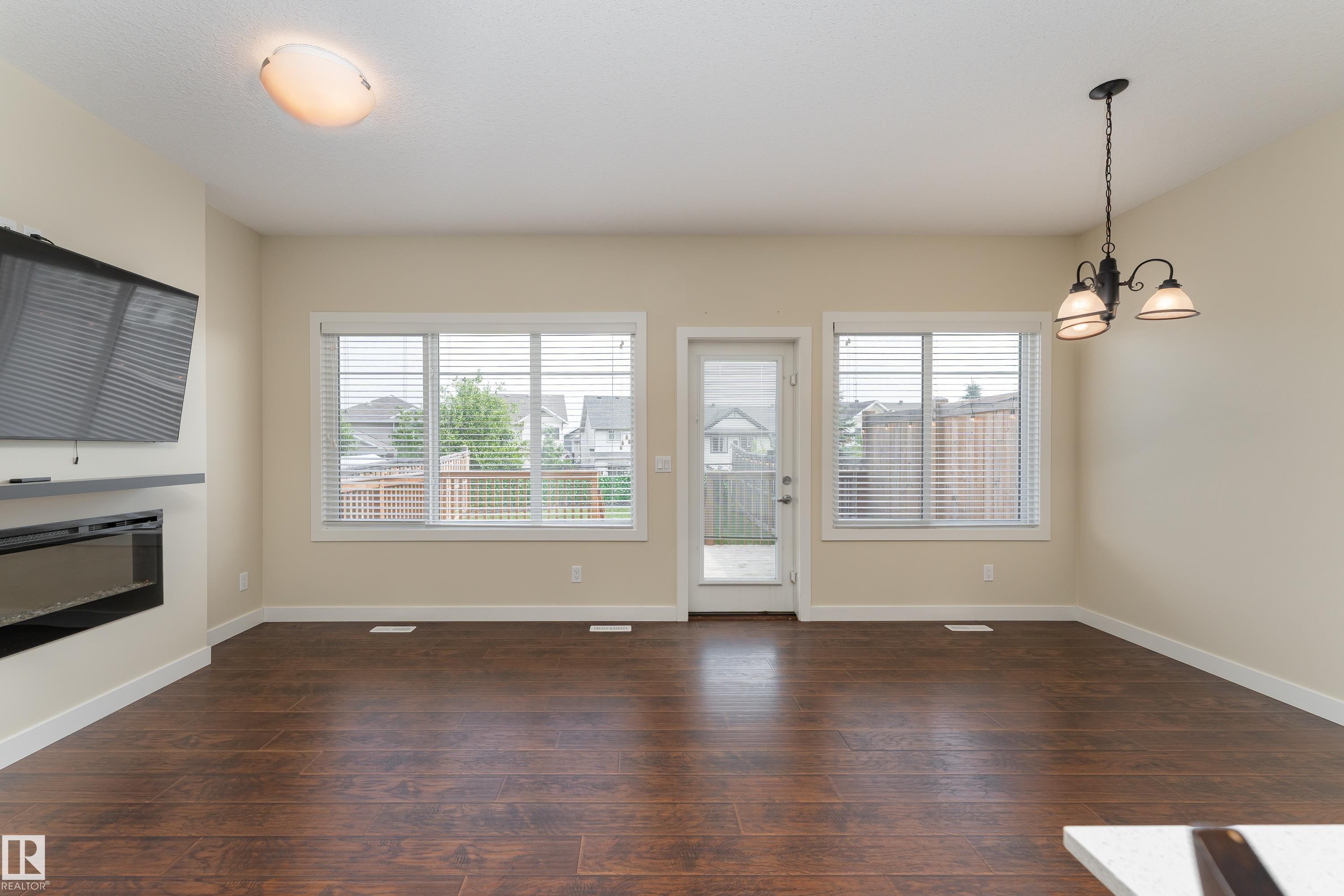 8589 Cushing Place Sw, Edmonton, AB - Indoor Photo Showing Other Room With Fireplace