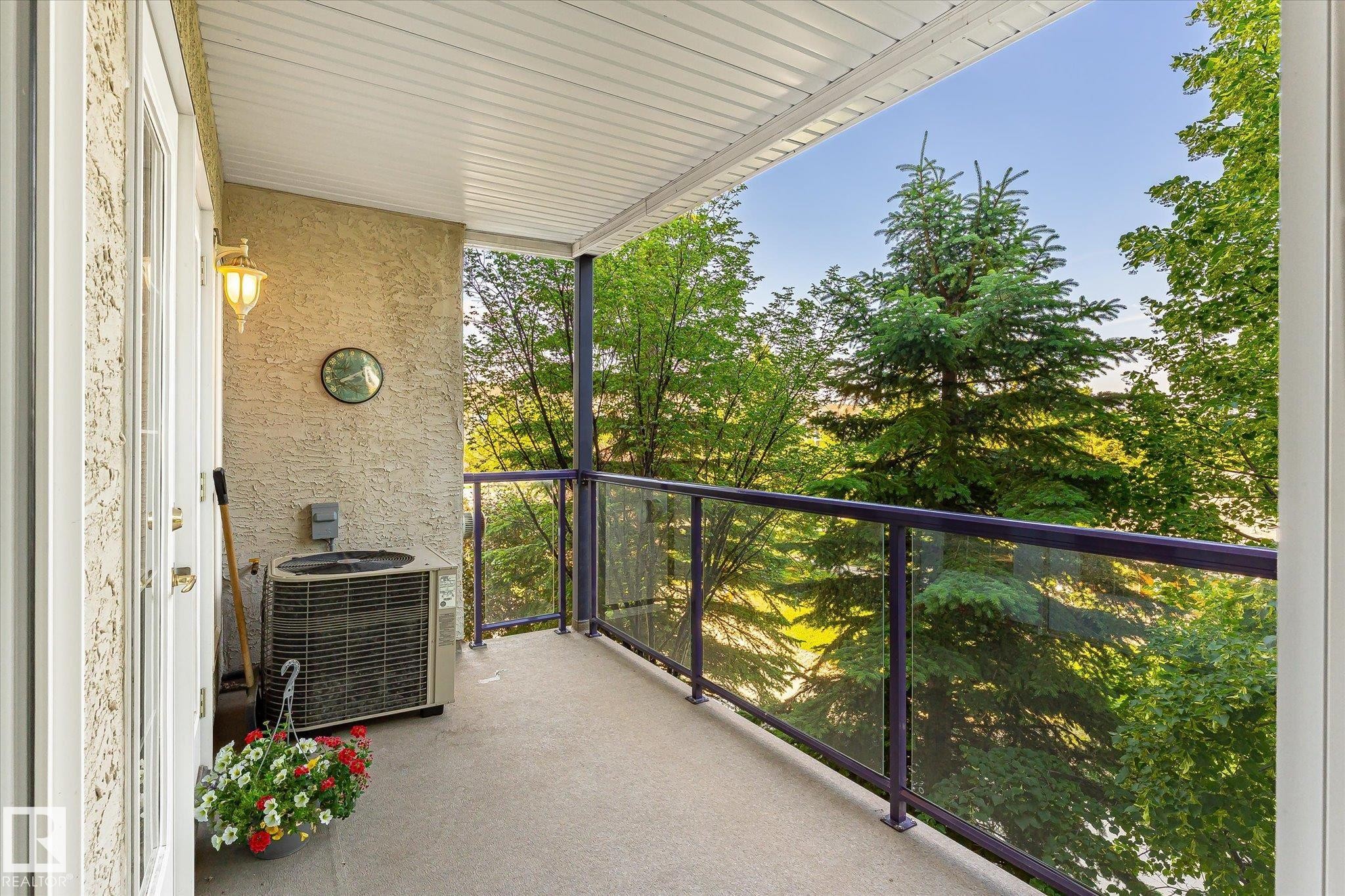 Private balcony with stucco exterior and concrete flooring - #310 237 Youville Dr E Nw, Edmonton, AB - Outdoor With Balcony With Exterior