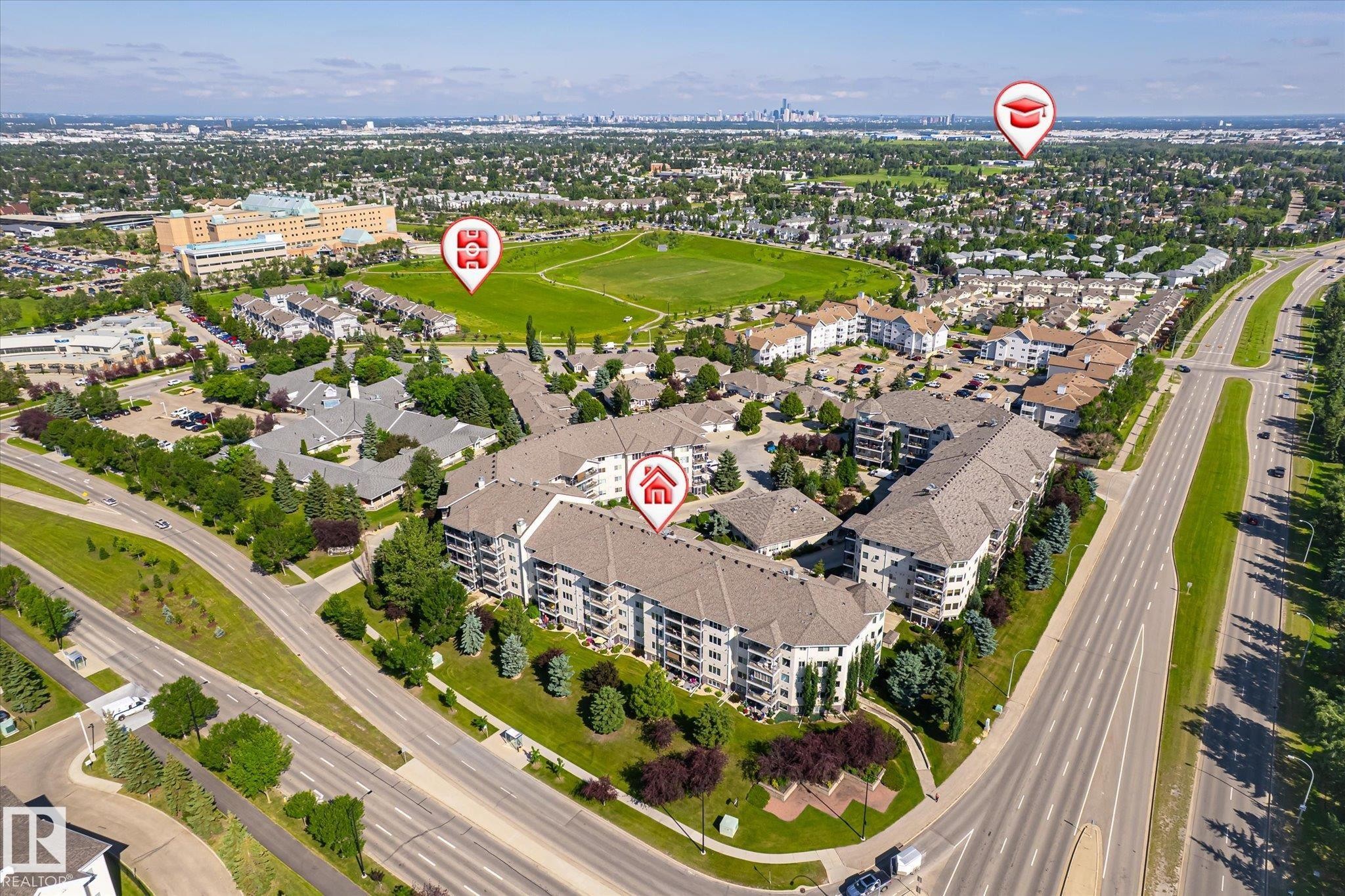 Aerial perspective showcasing a multi-building residential complex - #310 237 Youville Dr E Nw, Edmonton, AB - Outdoor With View