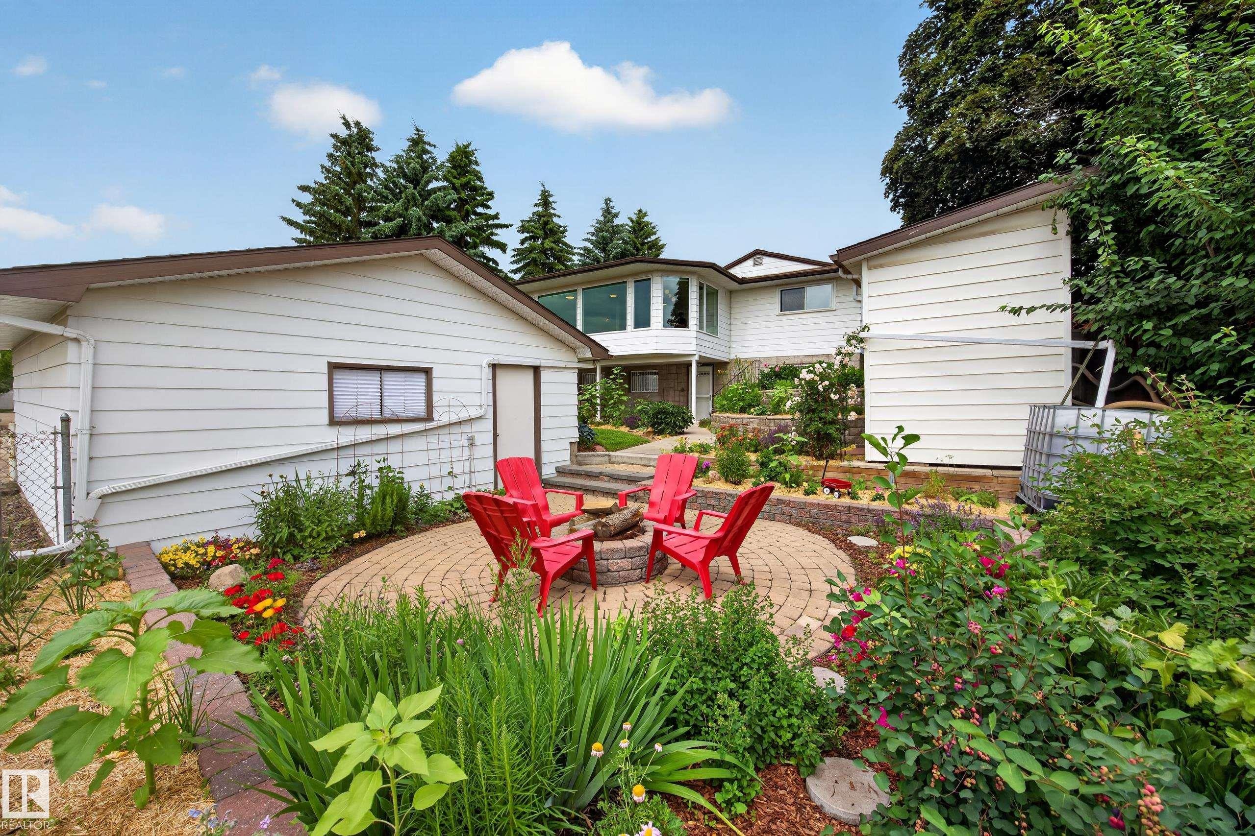 Circular paver patio with a central fire pit - 3411 103 Avenue Nw, Edmonton, AB