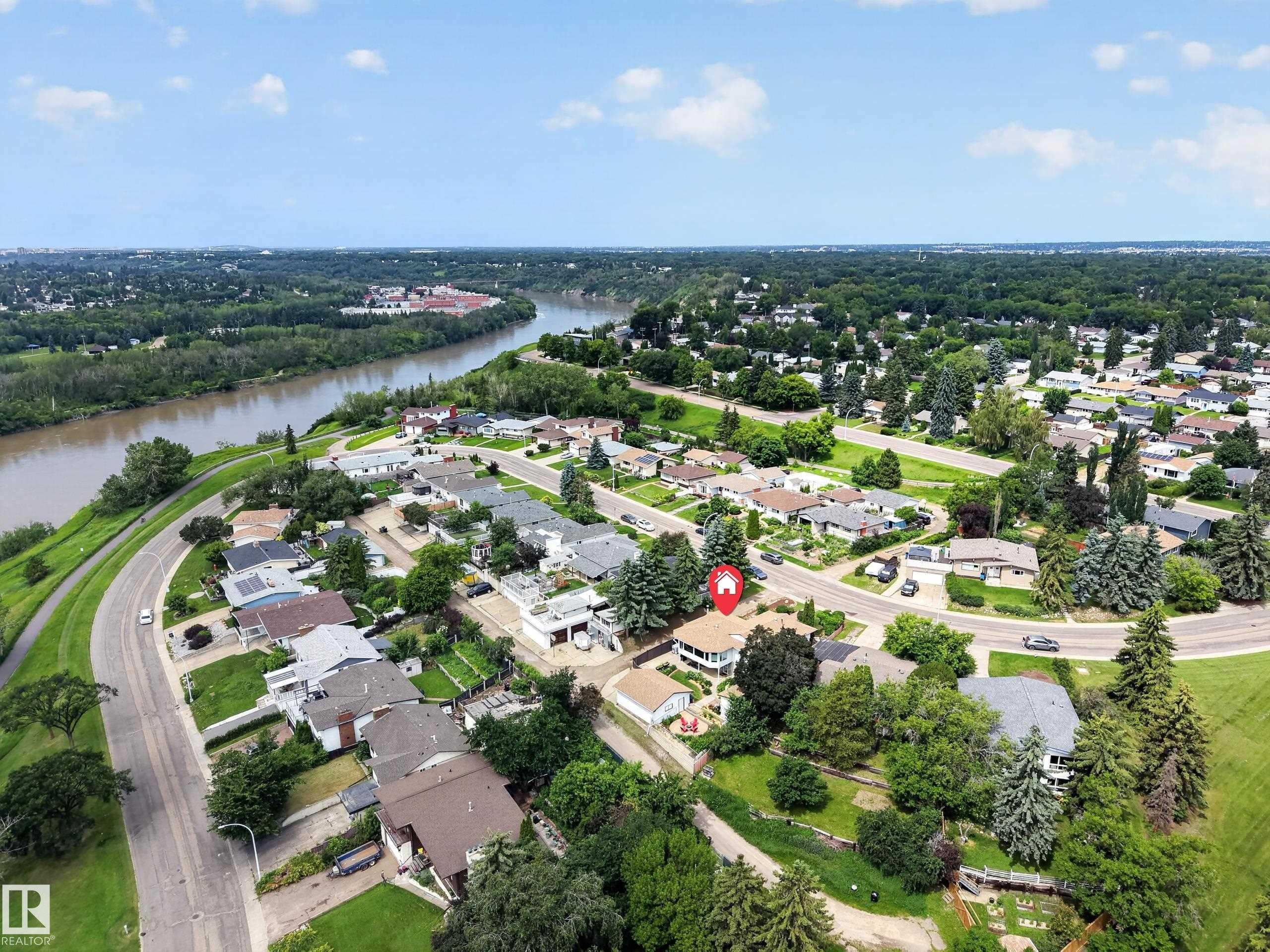 Aerial perspective showcasing a residential neighborhood bordering a river - 3411 103 Avenue Nw, Edmonton, AB