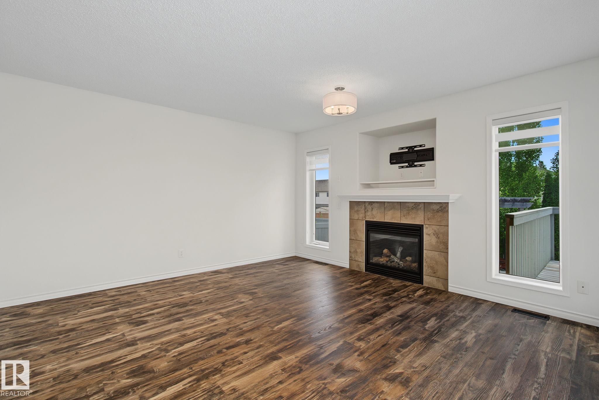 616 61 Street Sw, Edmonton, AB - Indoor Photo Showing Living Room With Fireplace