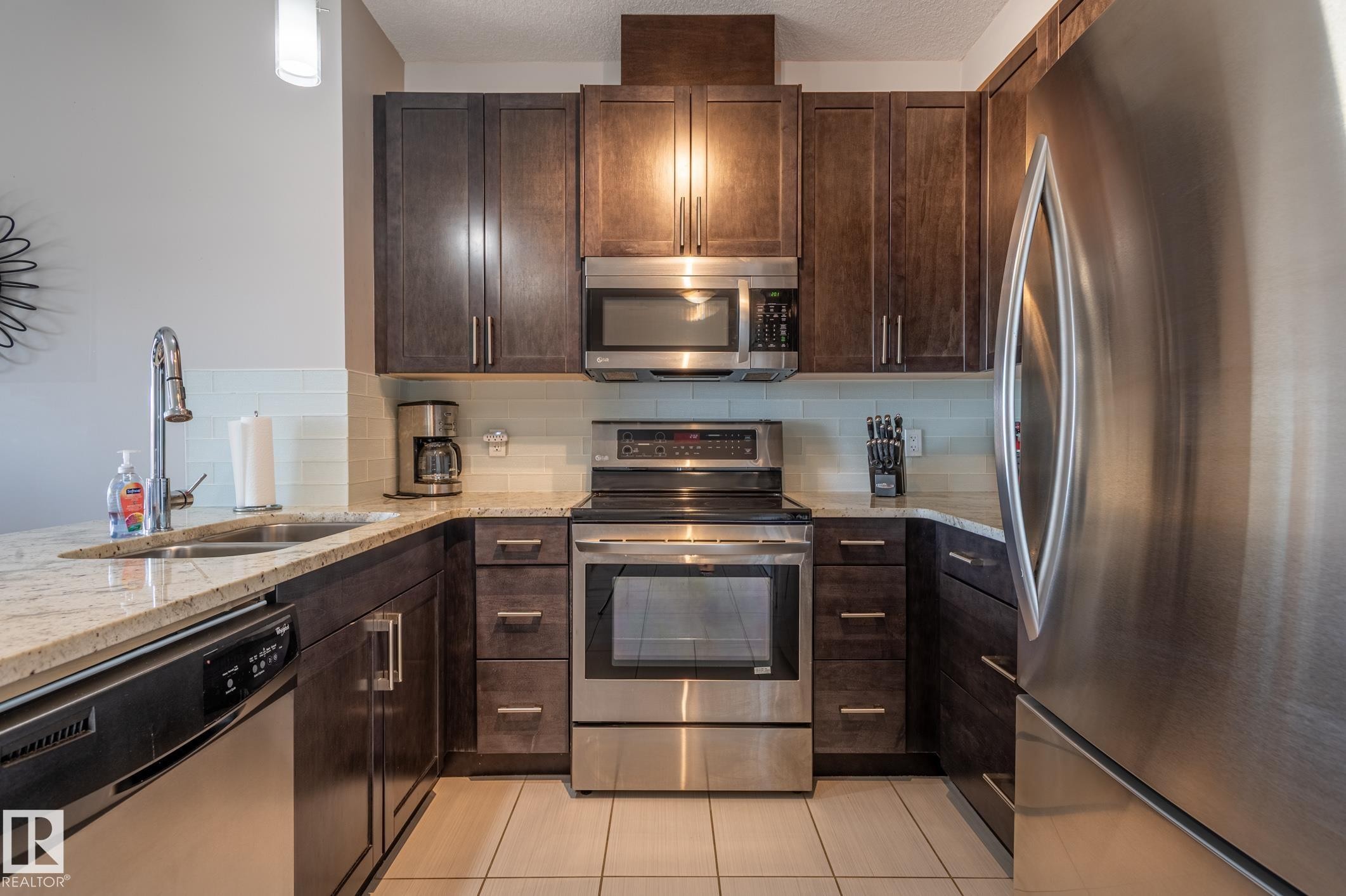 #305 5151 Windermere Bv Nw, Edmonton, AB - Indoor Photo Showing Kitchen With Double Sink