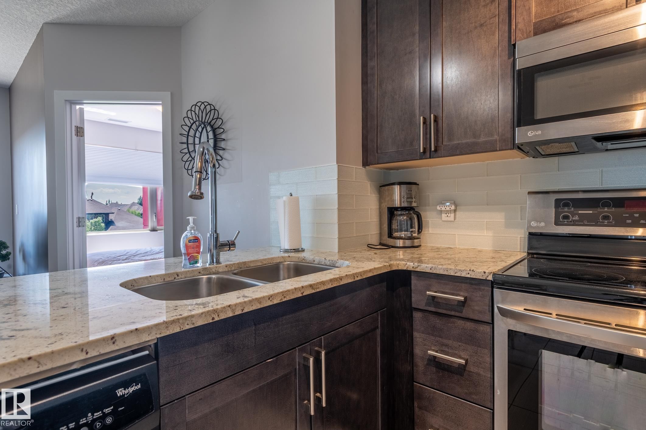 #305 5151 Windermere Bv Nw, Edmonton, AB - Indoor Photo Showing Kitchen With Double Sink
