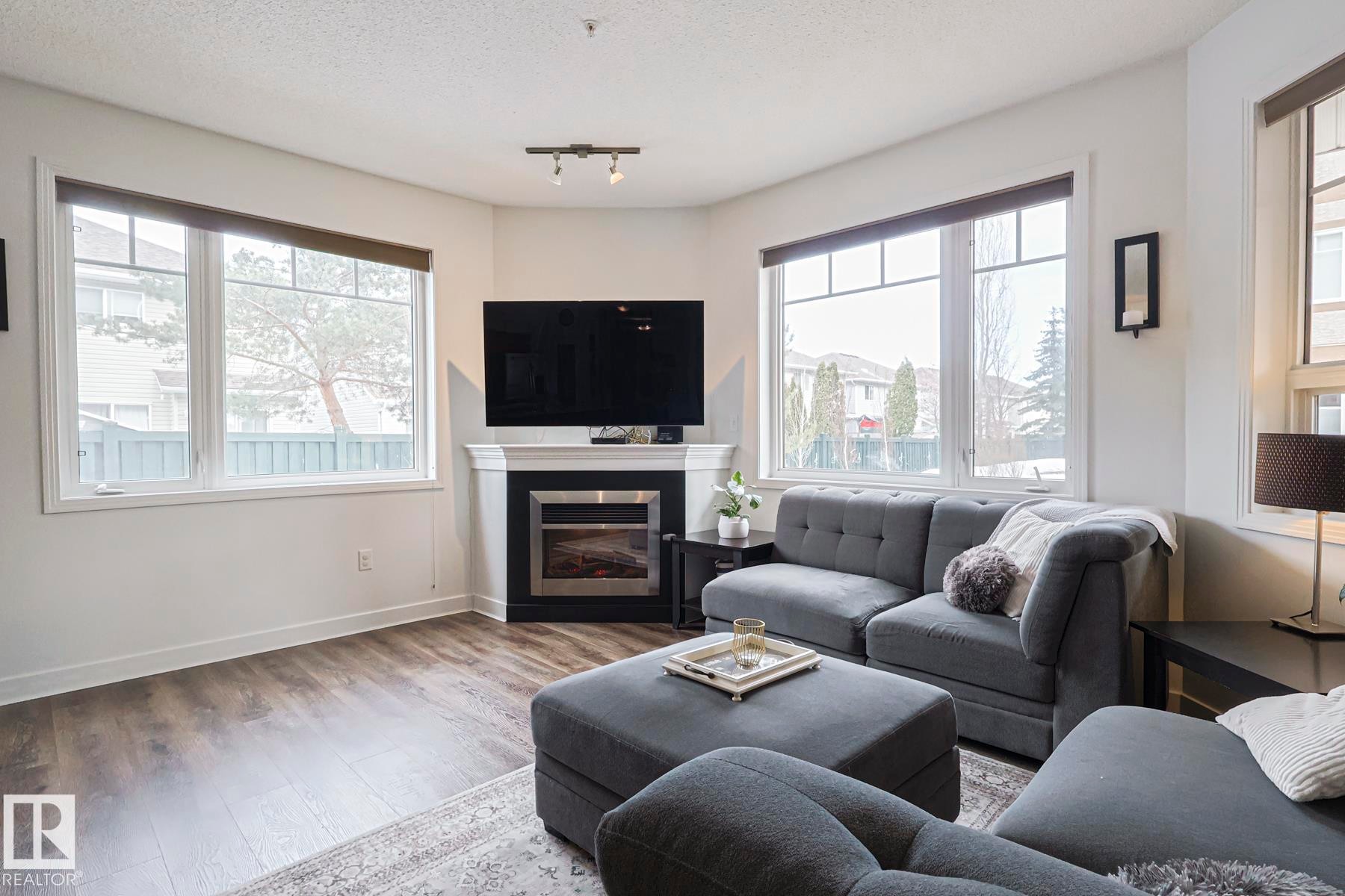 #111 2035 Grantham Co Nw, Edmonton, AB - Indoor Photo Showing Living Room With Fireplace